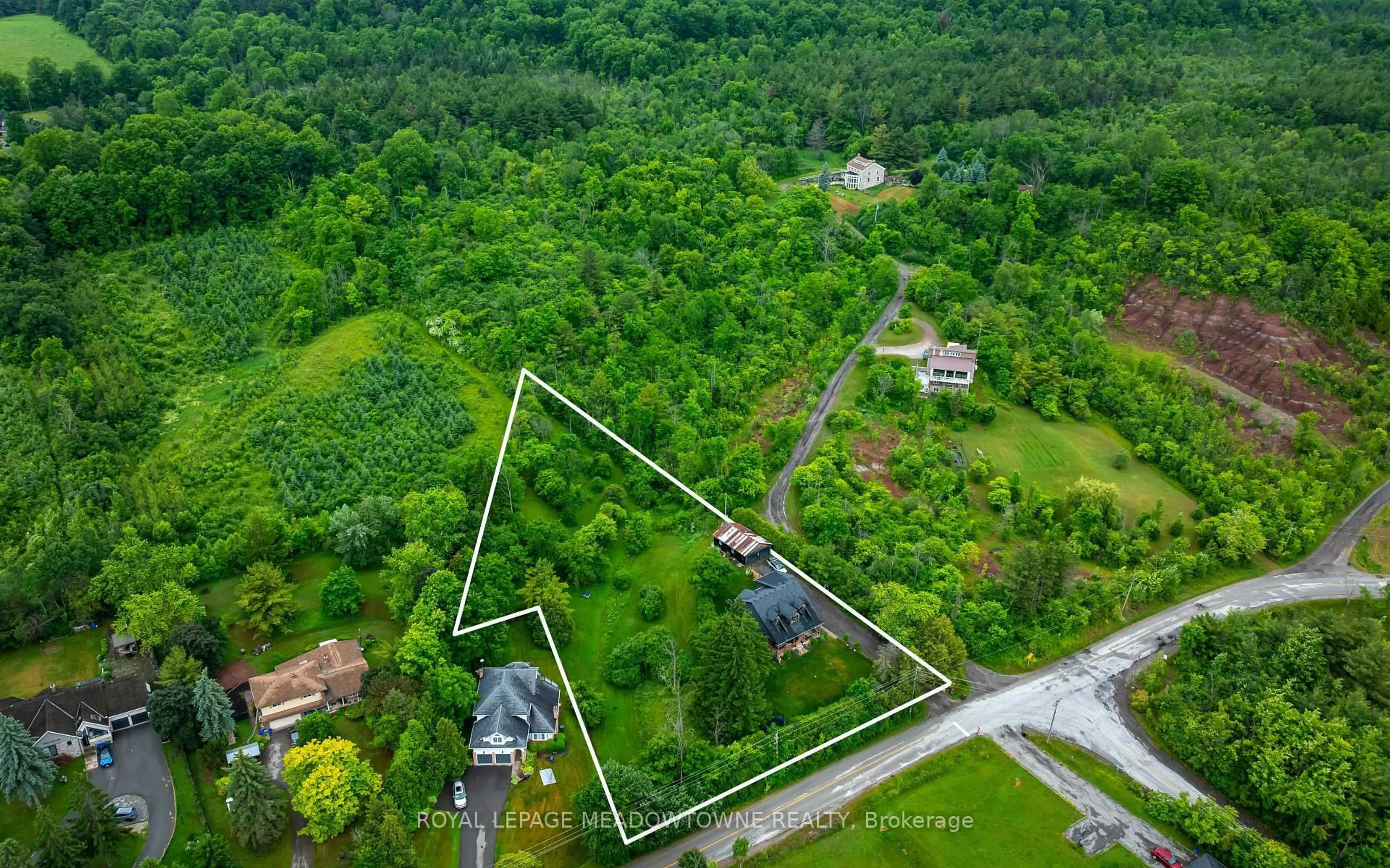 A pic from outside/outdoor area/front of a property/back of a property/a pic from drone, unknown for 13394 Tenth Line, Halton Hills Ontario L7G 4S8
