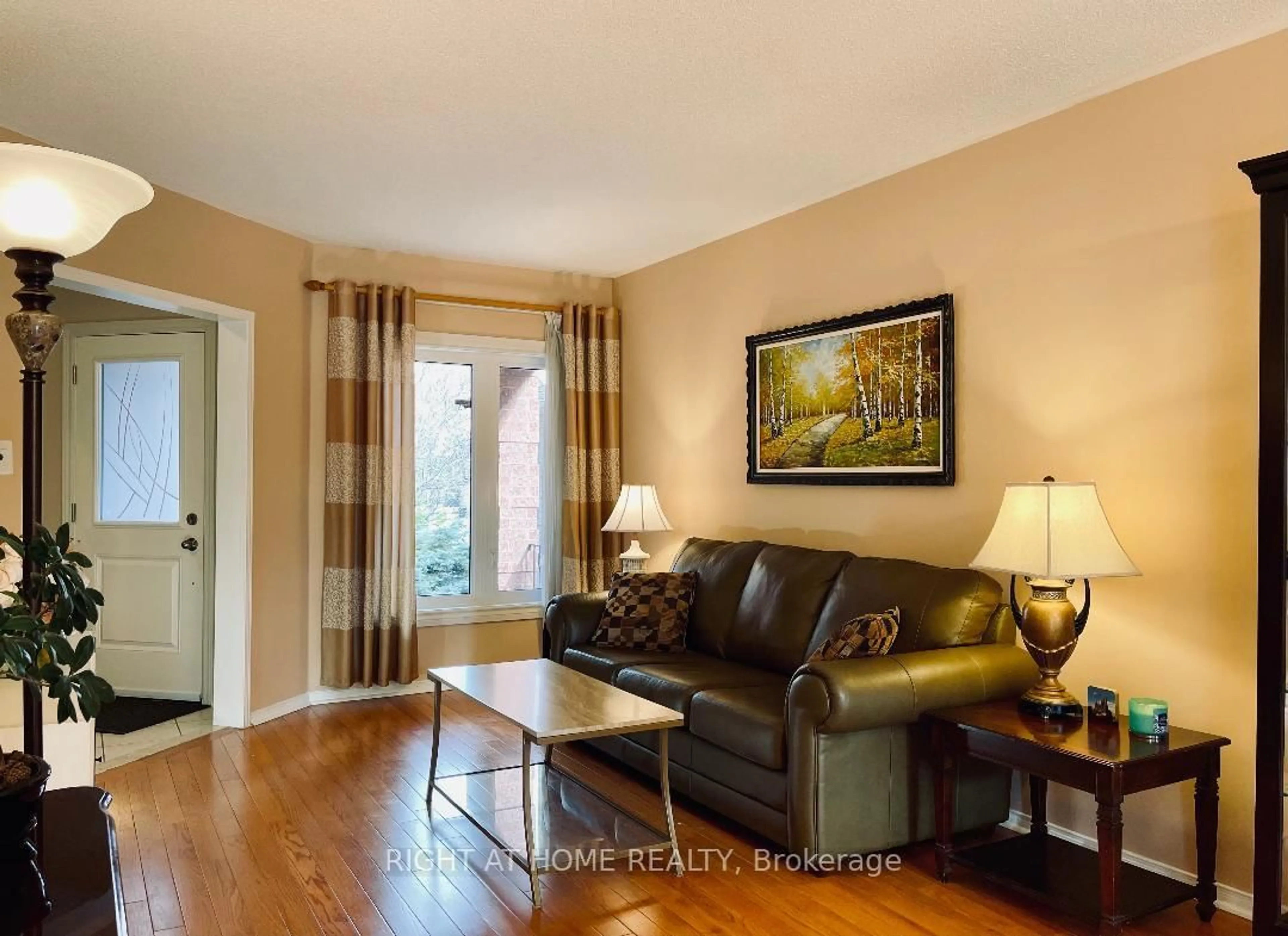 Living room with furniture, wood/laminate floor for 845 Mays Cres, Mississauga Ontario L5V 2G6