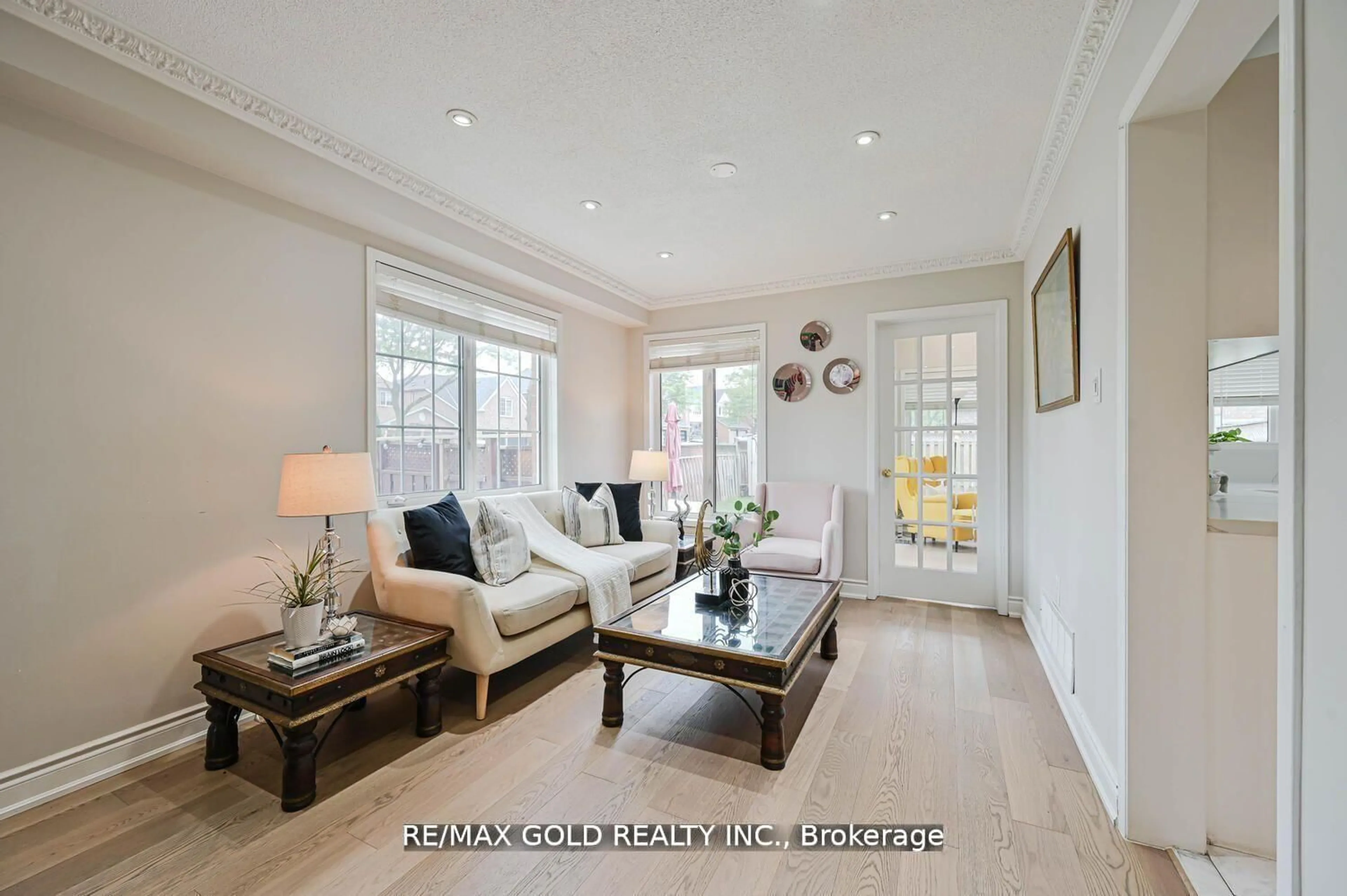 Living room with furniture, wood/laminate floor for 44 Ribbon Dr, Brampton Ontario L6R 2C5