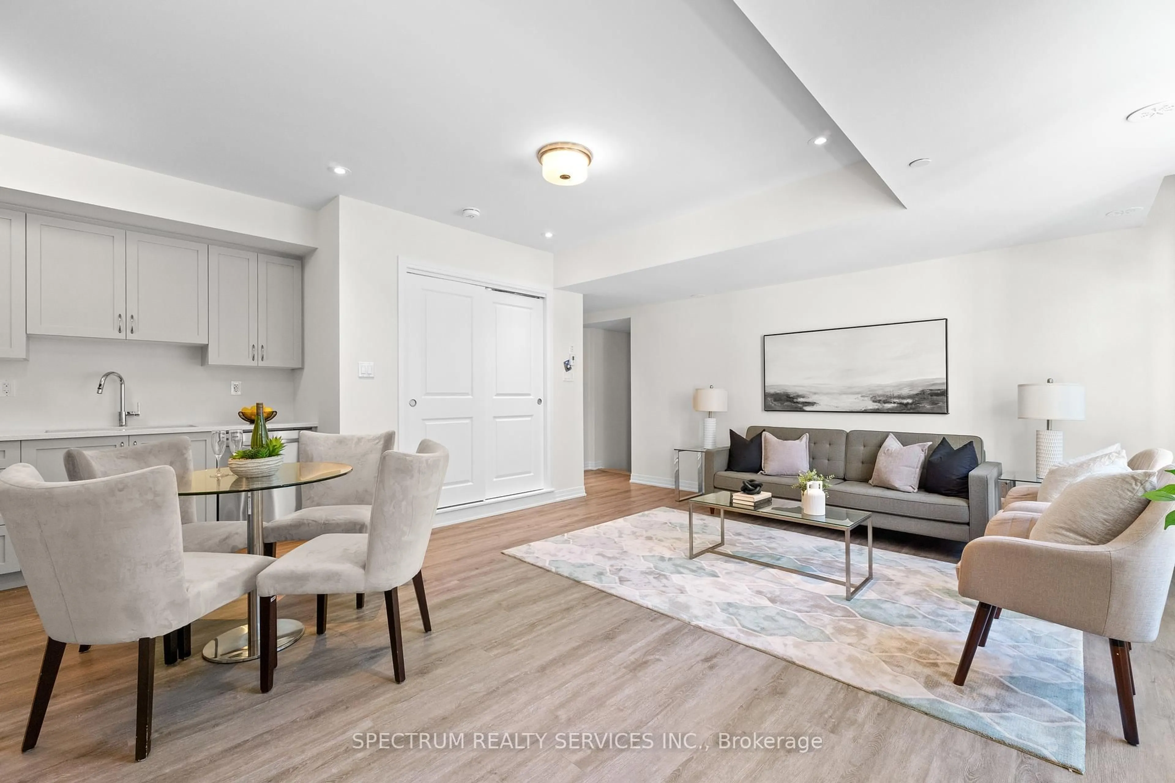 Living room with furniture, wood/laminate floor for 25 Fieldridge Cres #Lot 57, Brampton Ontario L6R 4G6