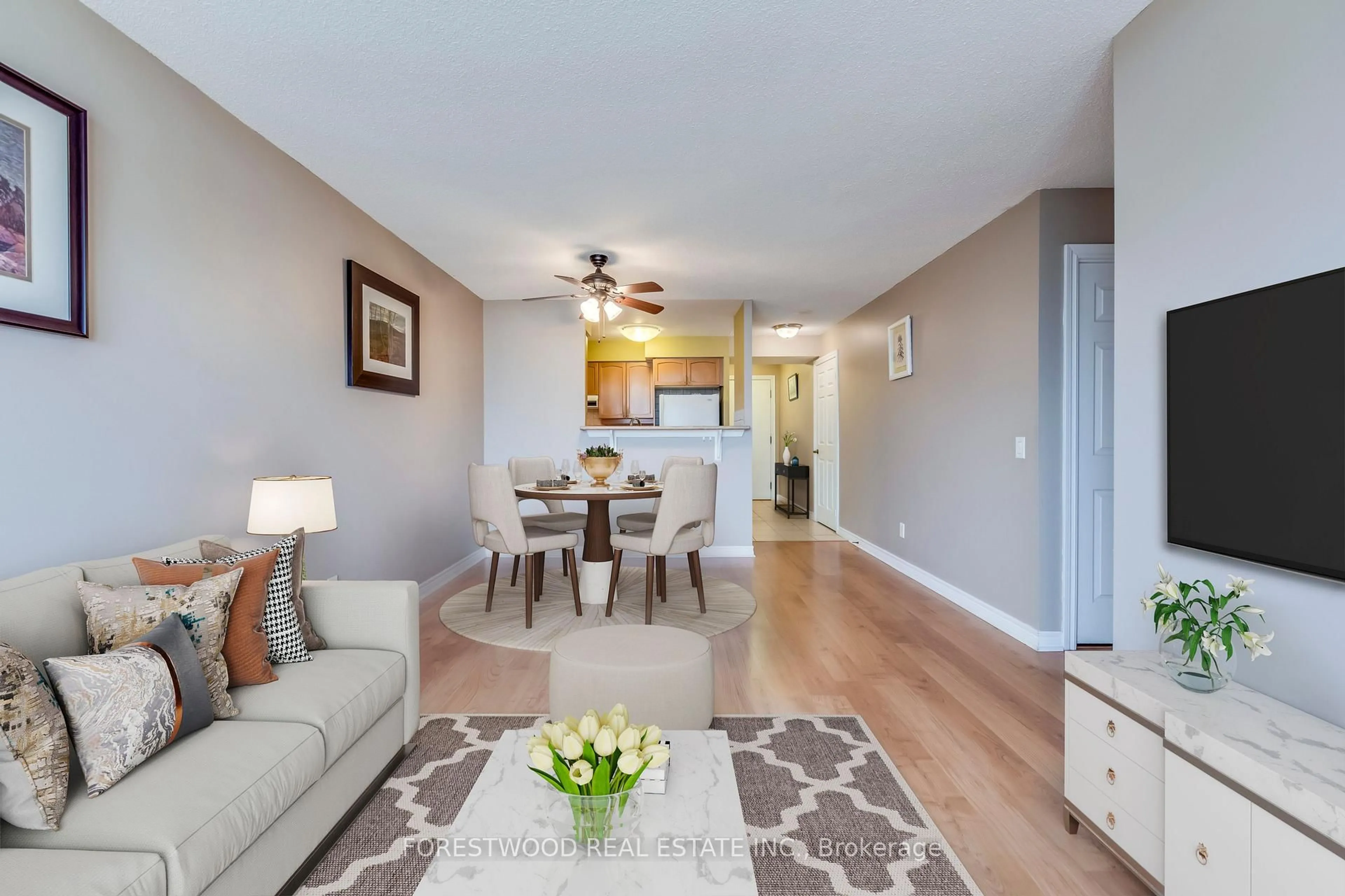 Living room with furniture, wood/laminate floor for 710 HUMBERWOOD Blvd #2002, Toronto Ontario M3L 3W3