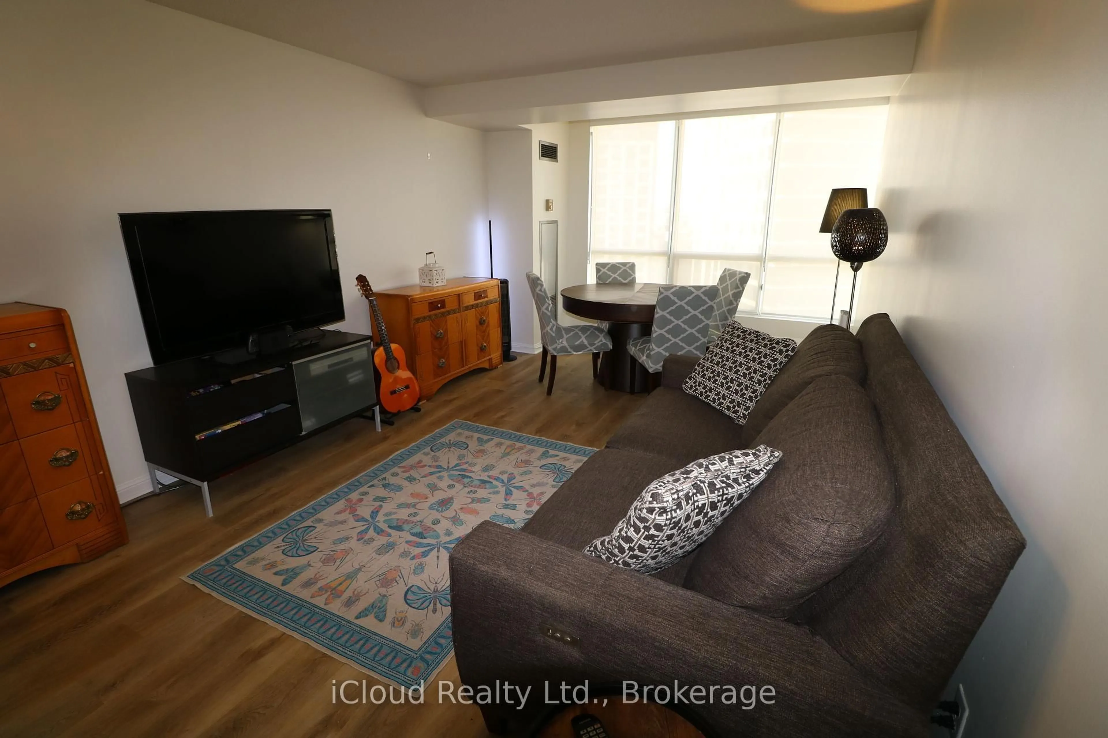 Living room with furniture, wood/laminate floor for 101 Subway Cres #1502, Toronto Ontario M9B 6K4