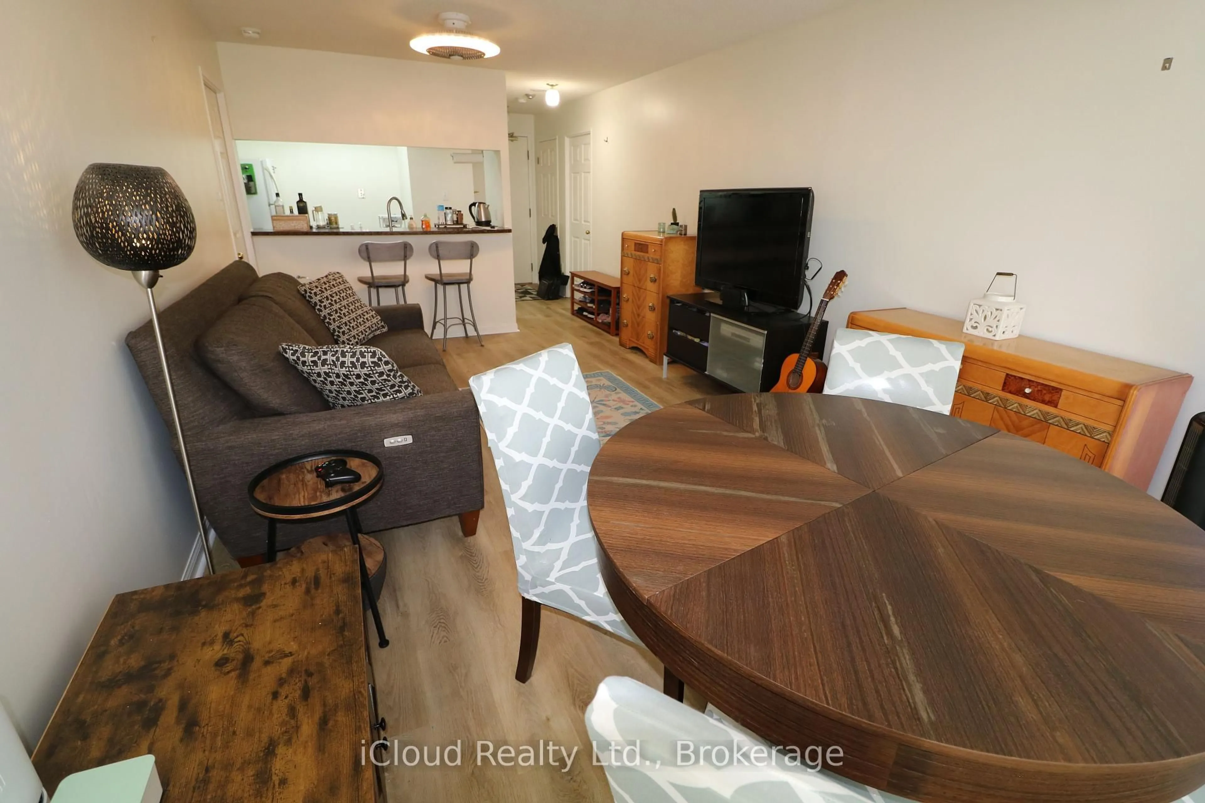 Living room with furniture, wood/laminate floor for 101 Subway Cres #1502, Toronto Ontario M9B 6K4