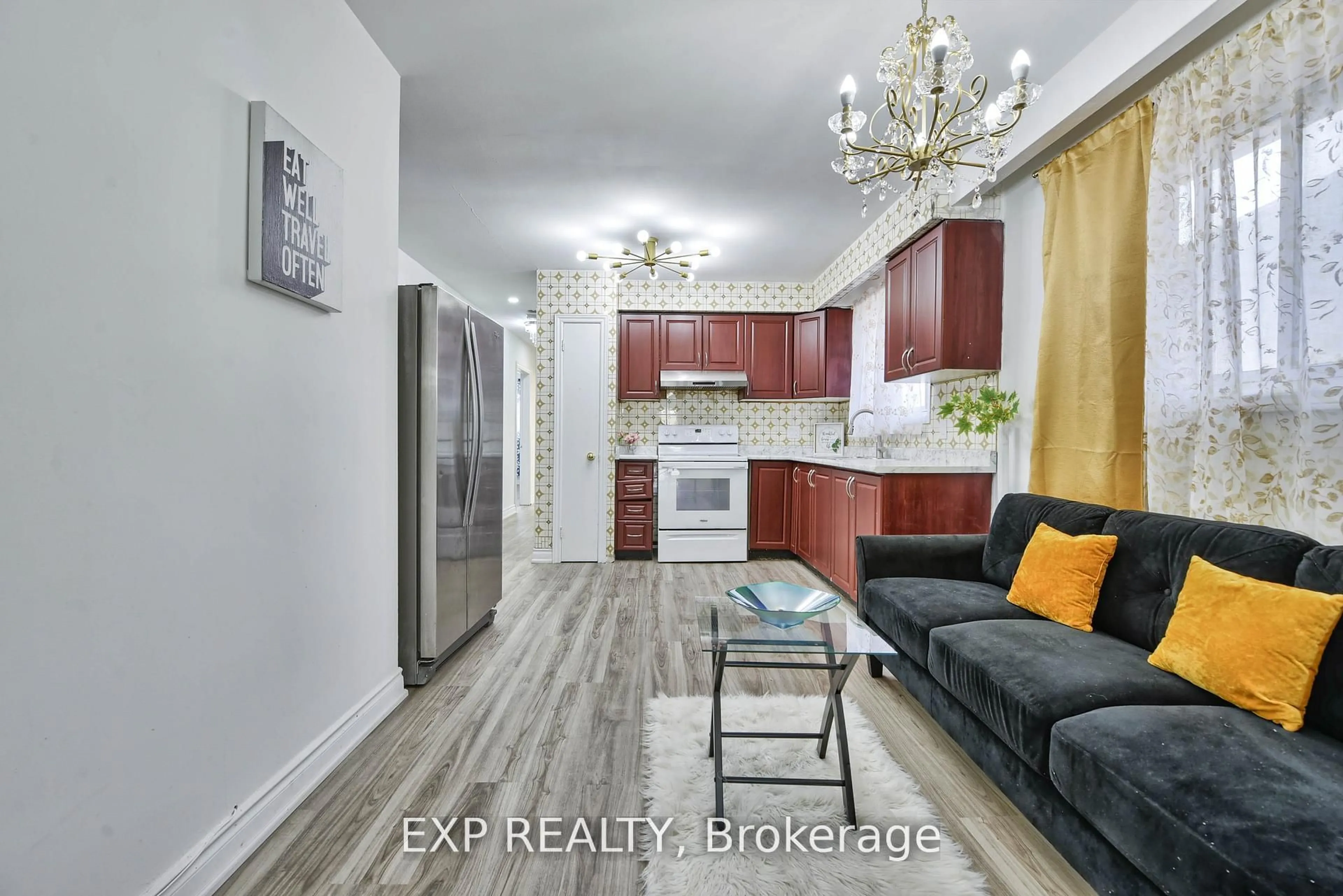 Open concept kitchen, wood/laminate floor for 7292 Redfox Rd, Mississauga Ontario L4T 2L8