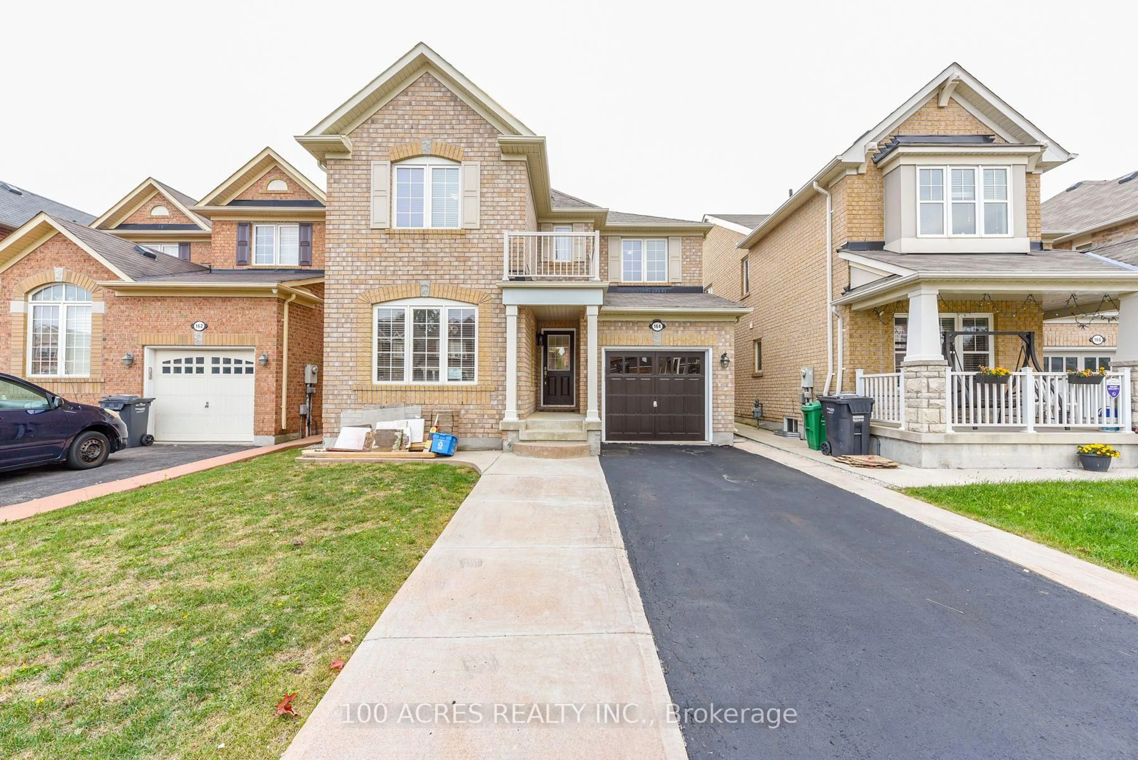 Home with brick exterior material, street for 164 Gardenbrooke Tr, Brampton Ontario L6P 3C9