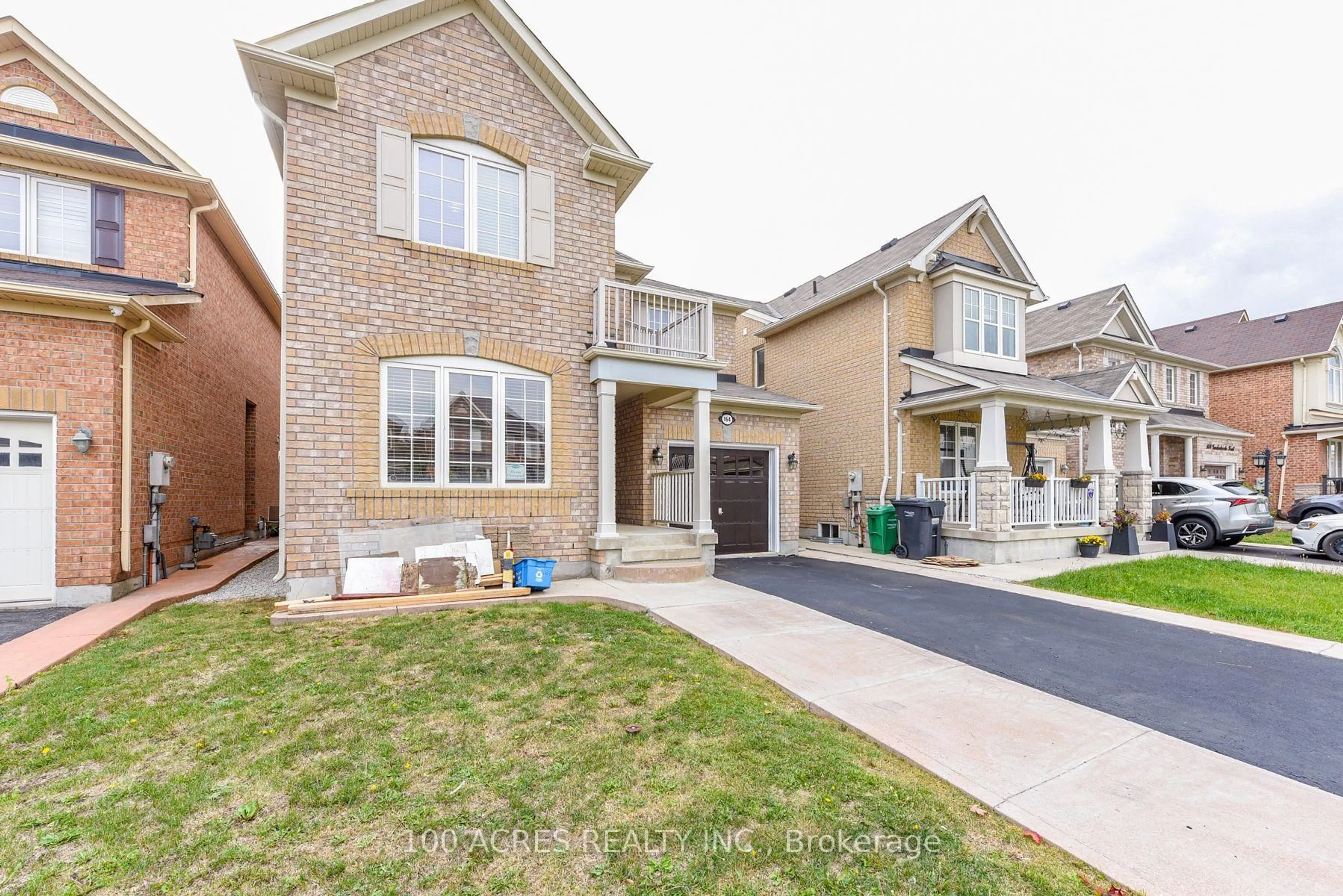 Home with brick exterior material, street for 164 Gardenbrooke Tr, Brampton Ontario L6P 3C9