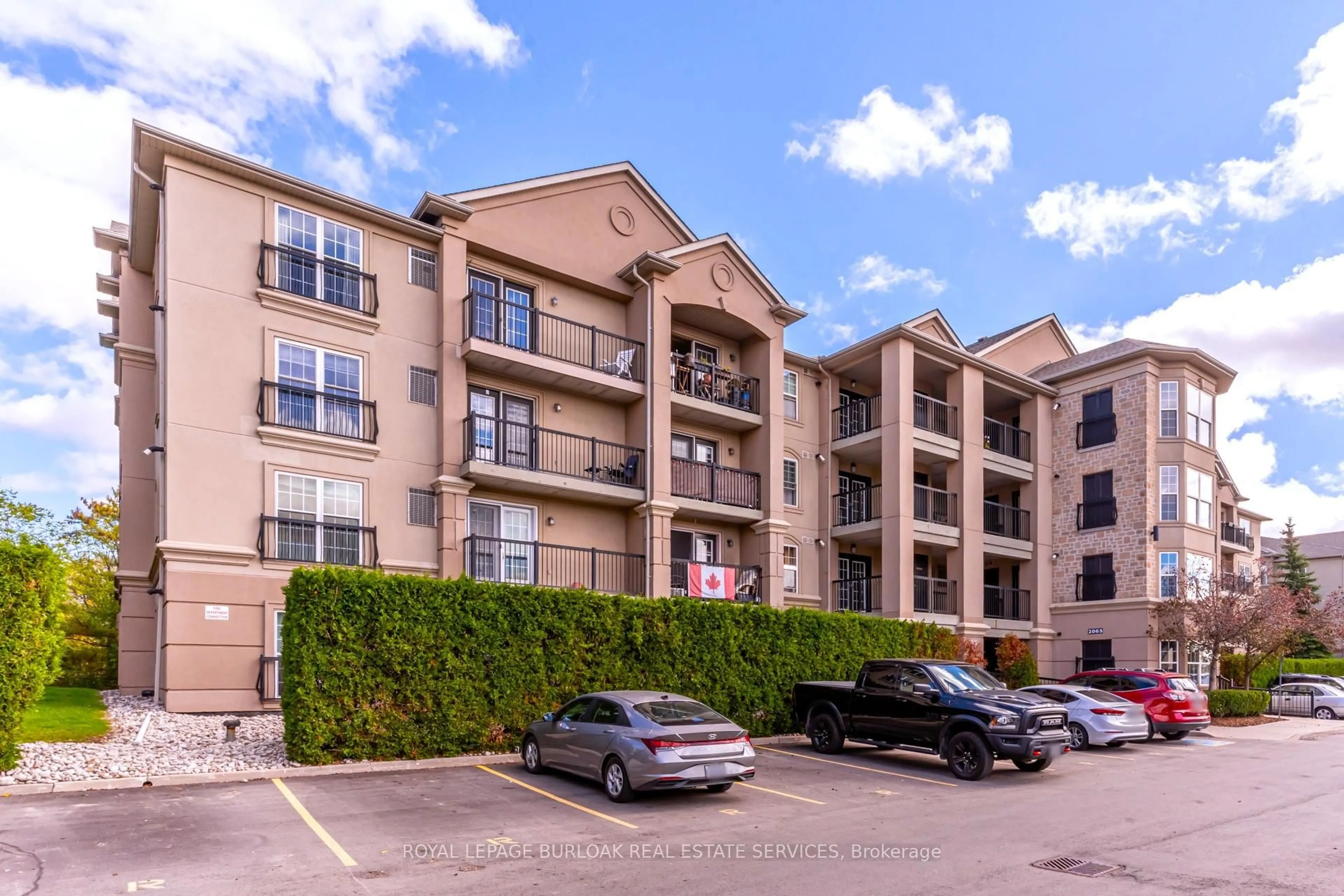 A pic from outside/outdoor area/front of a property/back of a property/a pic from drone, unknown for 2065 Appleby Line #402, Burlington Ontario L7L 7H2