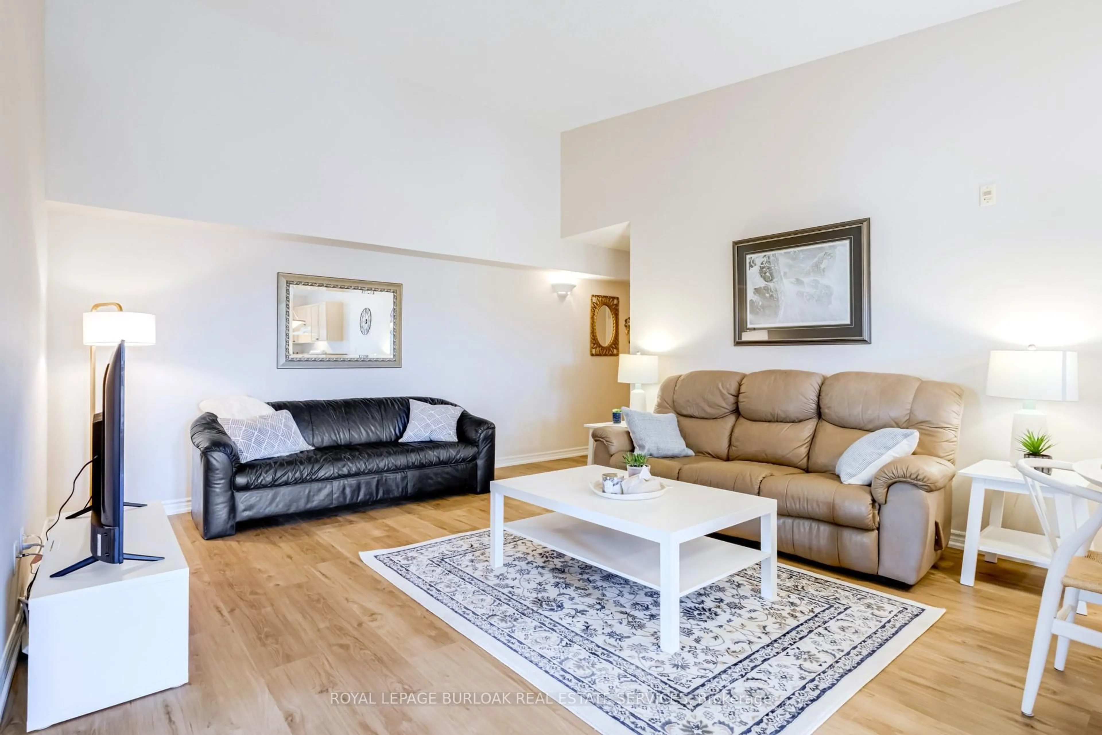 Living room with furniture, wood/laminate floor for 2065 Appleby Line #402, Burlington Ontario L7L 7H2