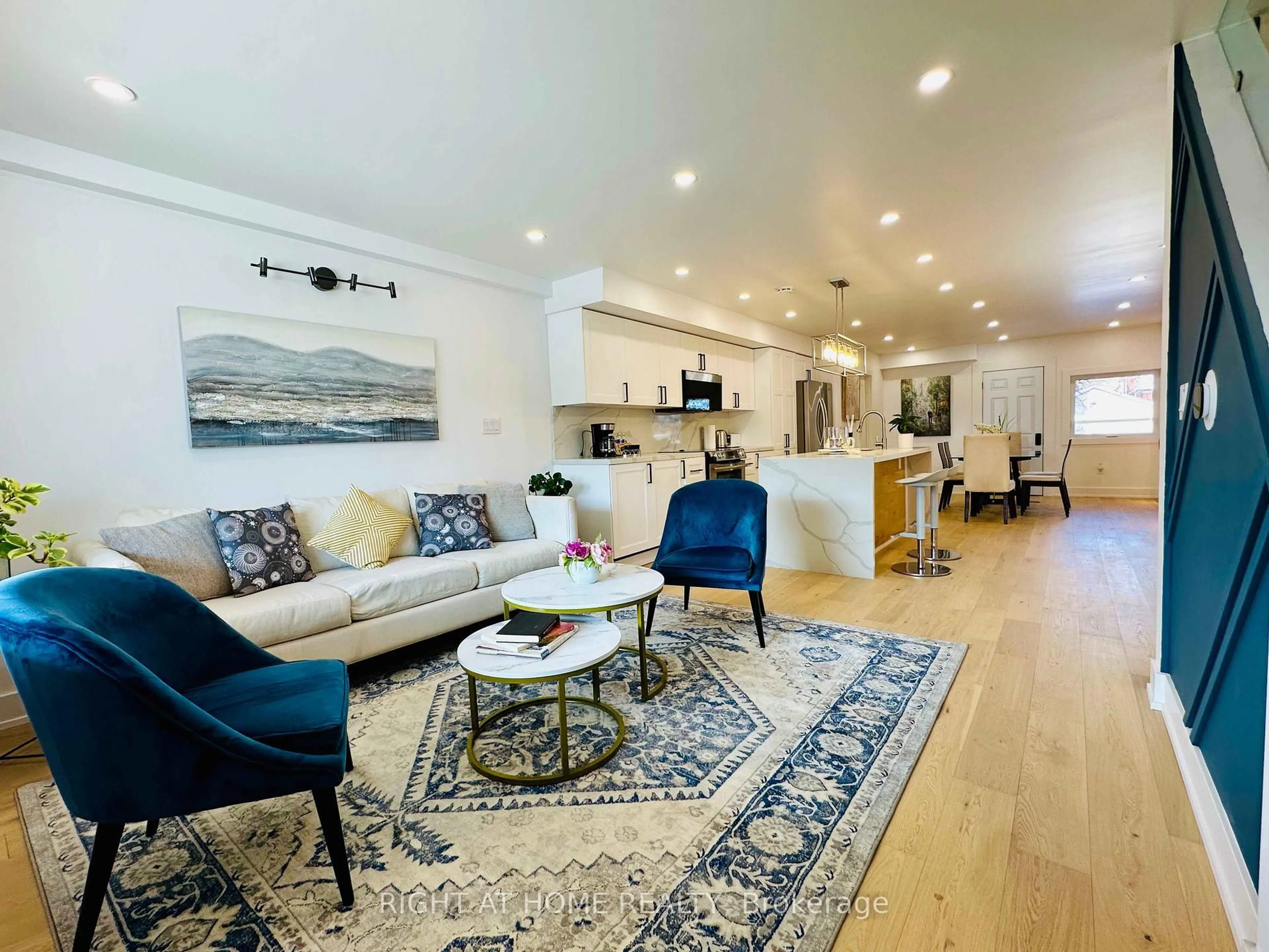 Living room with furniture, wood/laminate floor for 28 Pendeen Ave, Toronto Ontario M6N 2P3