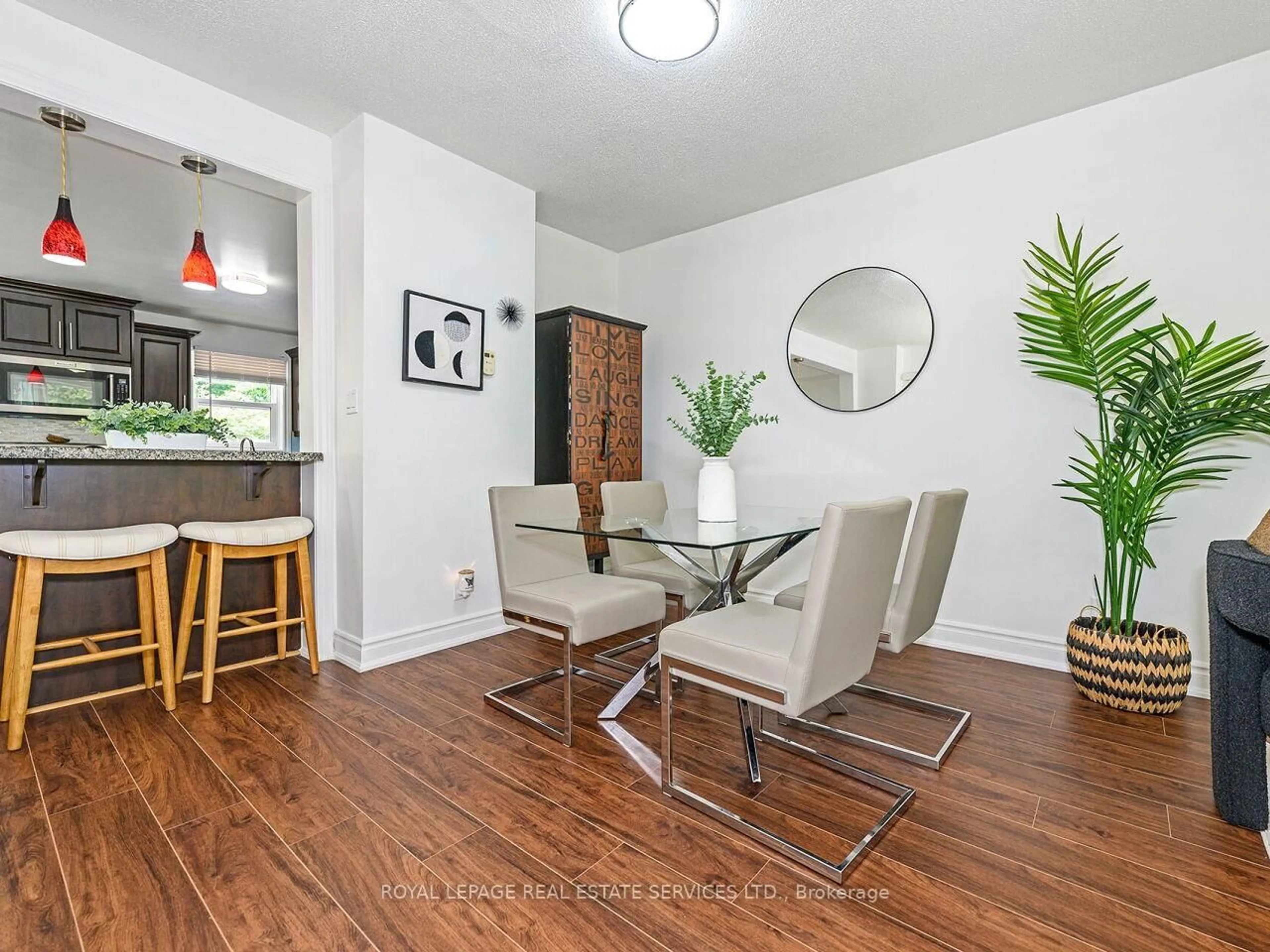 Living room with furniture, wood/laminate floor for 135 Bernice Cres, Toronto Ontario M6N 1X3