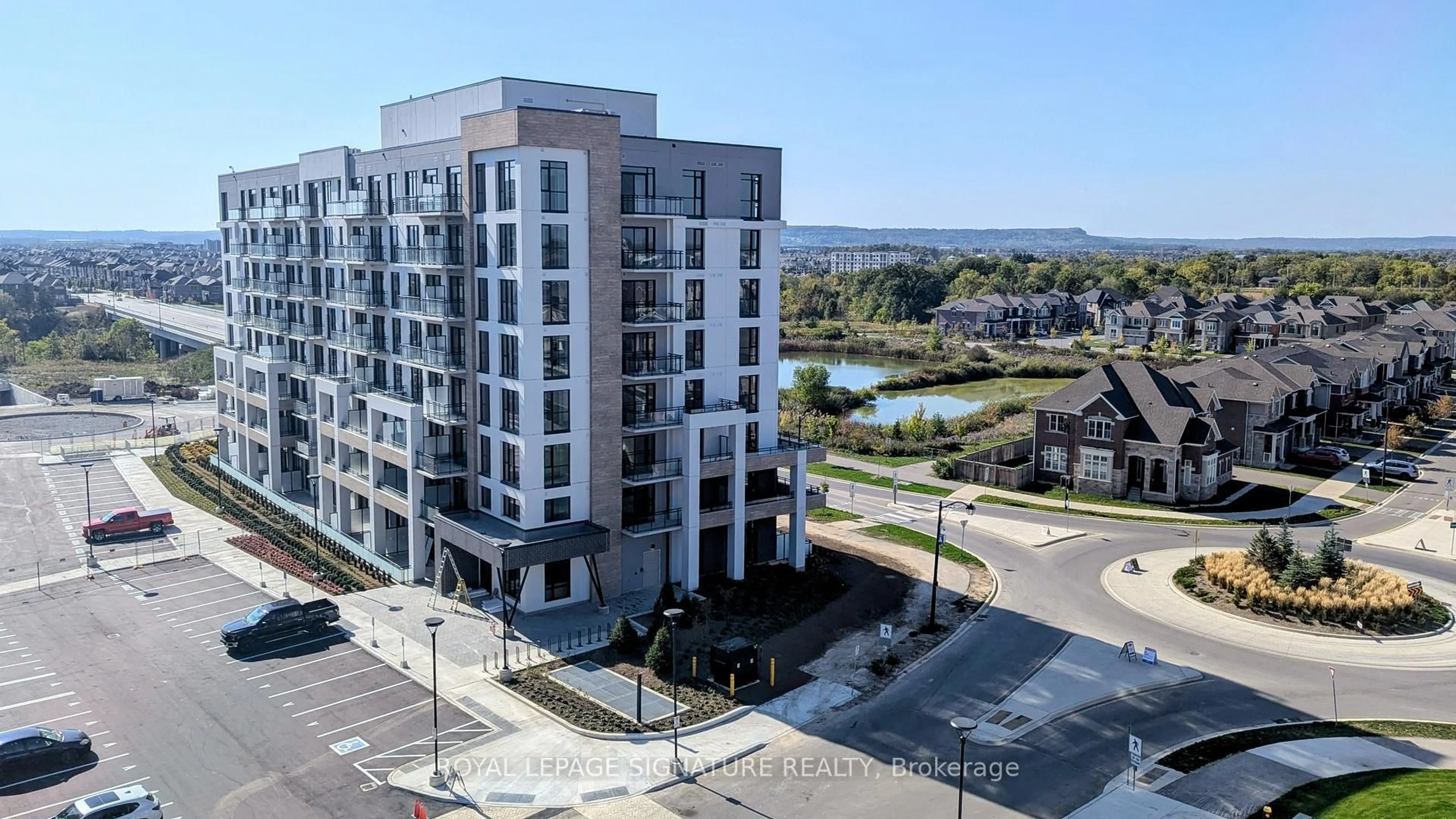 A pic from outside/outdoor area/front of a property/back of a property/a pic from drone, unknown for 720 Whitlock Ave #615, Milton Ontario L9E 1S2