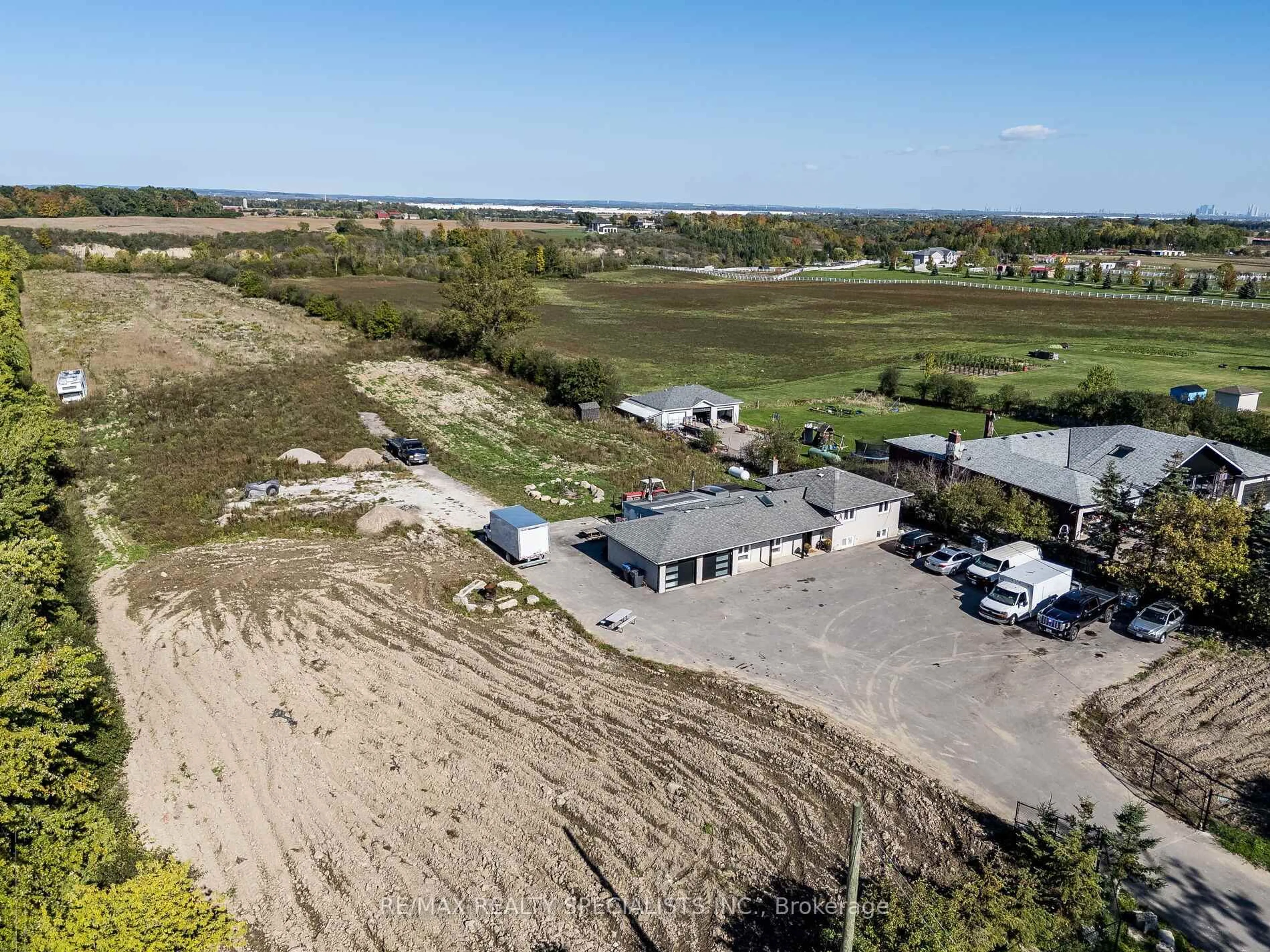 A pic from outside/outdoor area/front of a property/back of a property/a pic from drone, water/lake/river/ocean view for 13207 Centreville Creek Dr, Caledon Ontario L7C 3B8