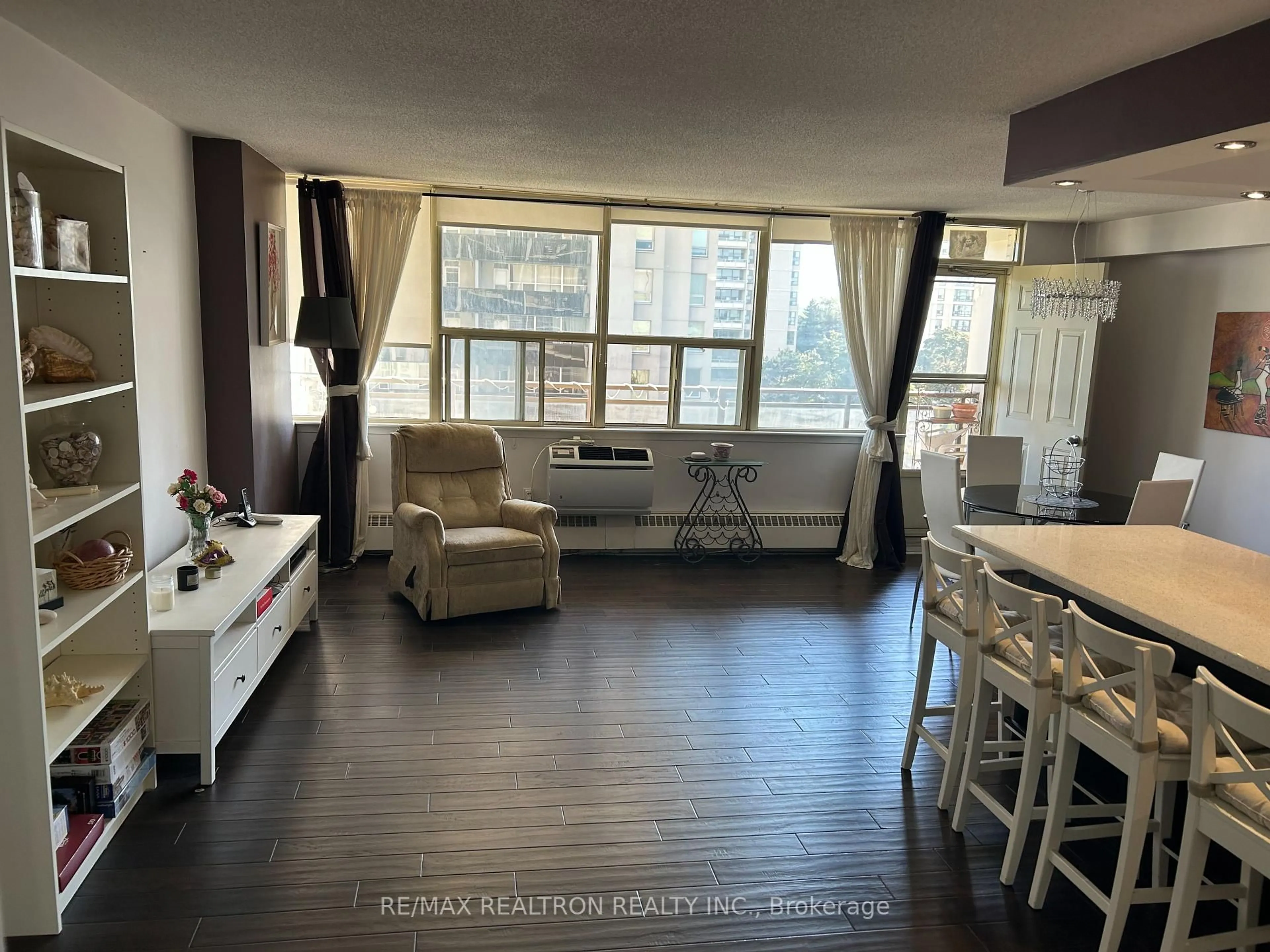 Living room with furniture, wood/laminate floor for 155 Marlee Ave #709, Toronto Ontario M6B 4B5