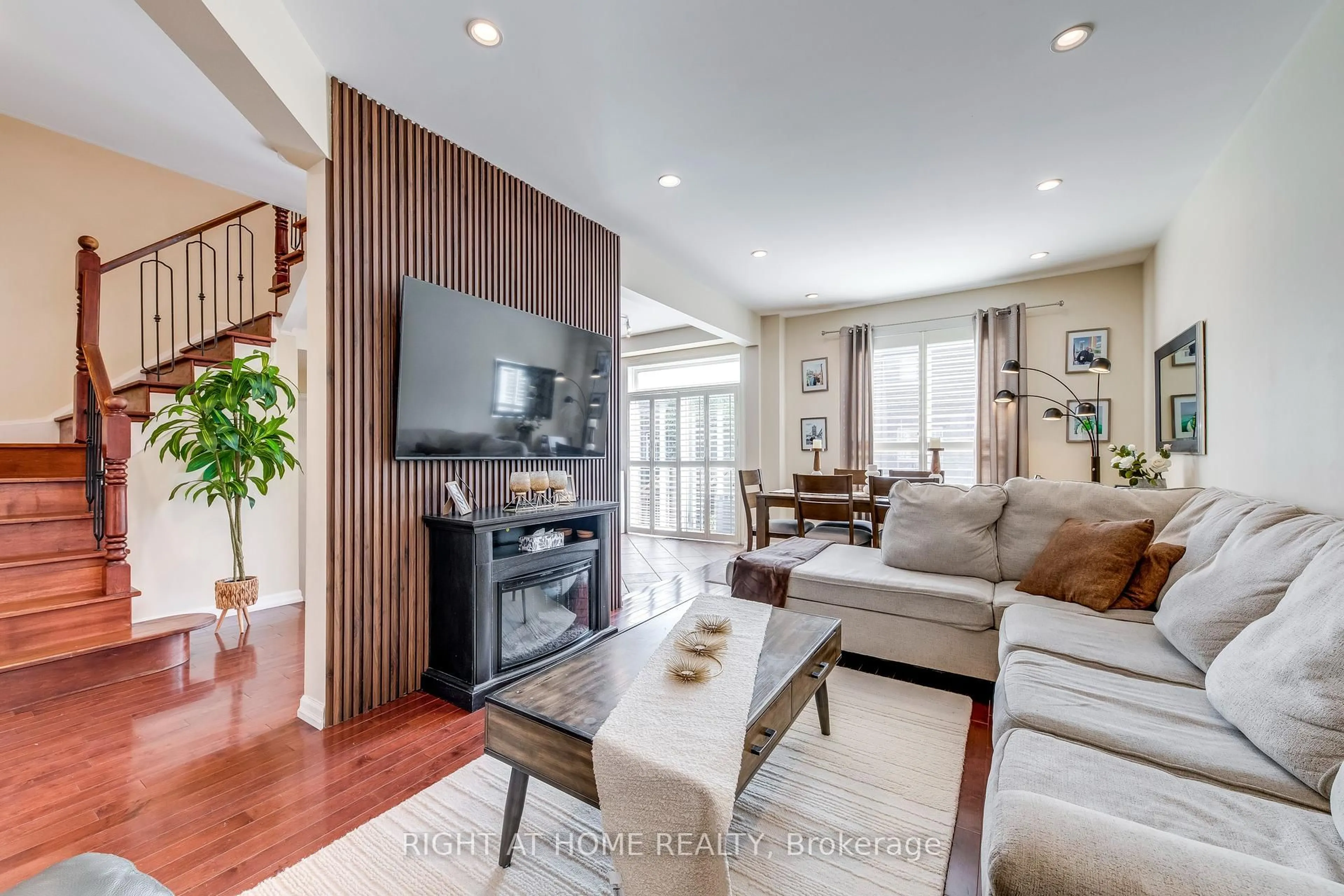 Living room with furniture, wood/laminate floor for 3048 Jenn Ave, Burlington Ontario L7M 0C8