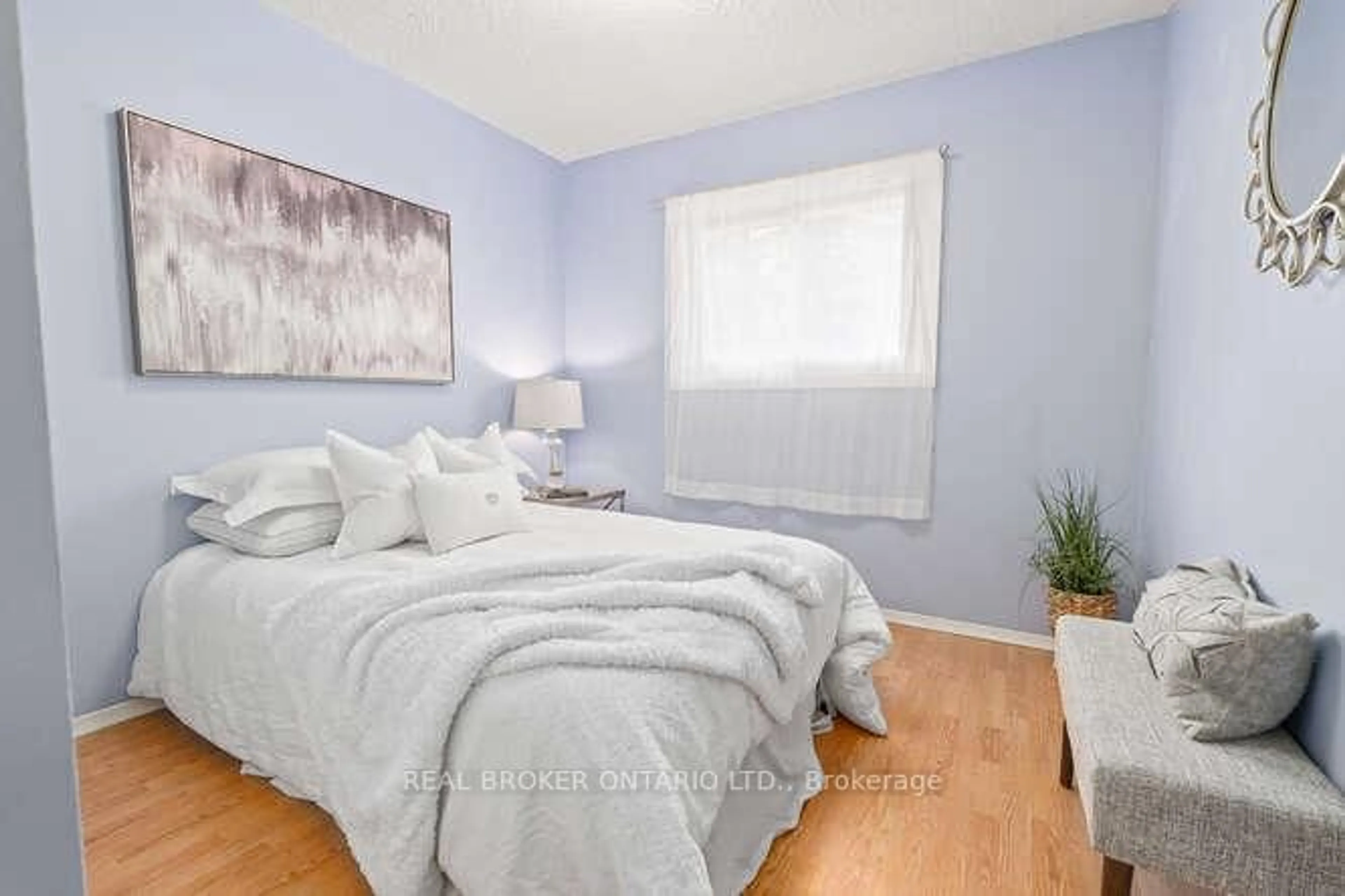 Bedroom with bed, wood/laminate floor for 19 Dayfoot Dr, Halton Hills Ontario L7G 2K8