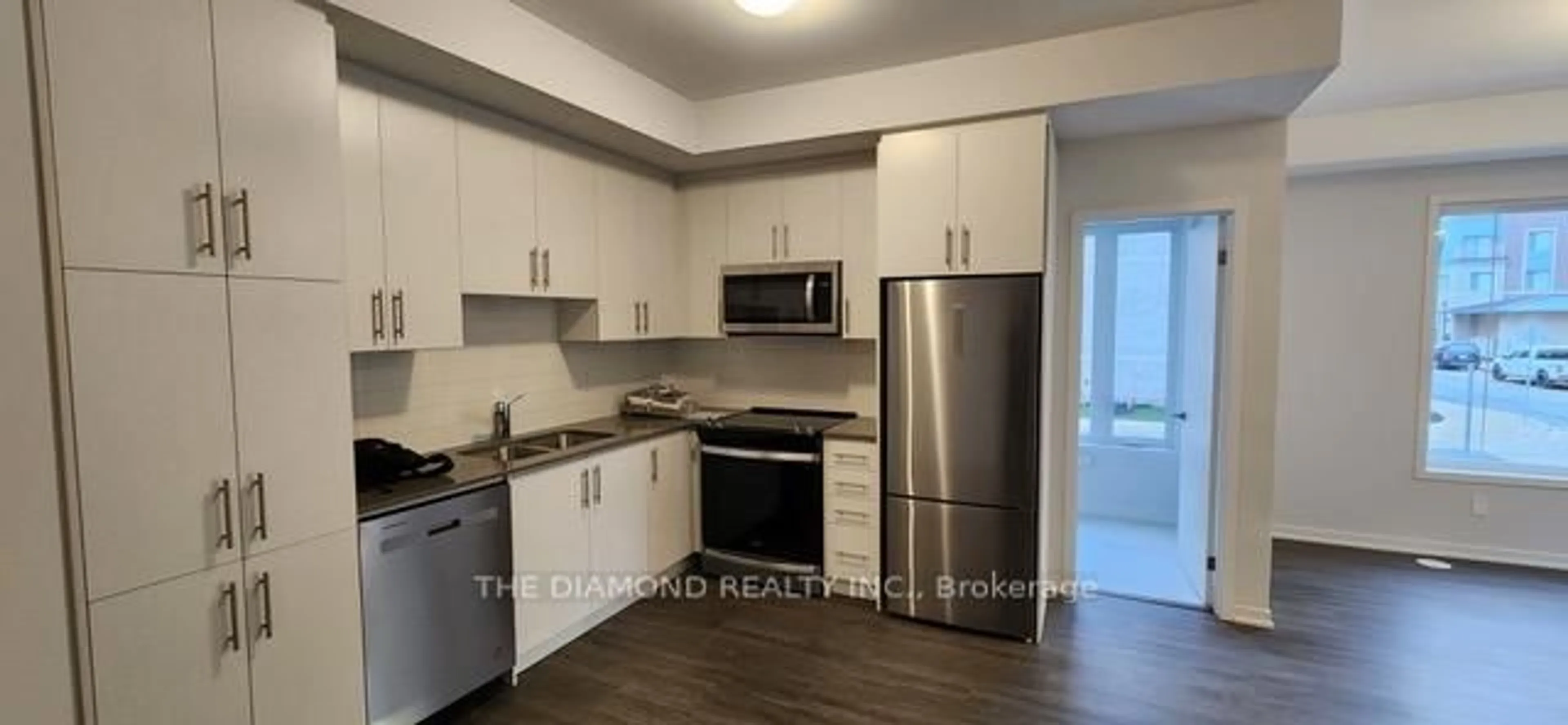 Standard kitchen, wood/laminate floor for 40 William Jackson Way #128, Toronto Ontario M8V 0J7