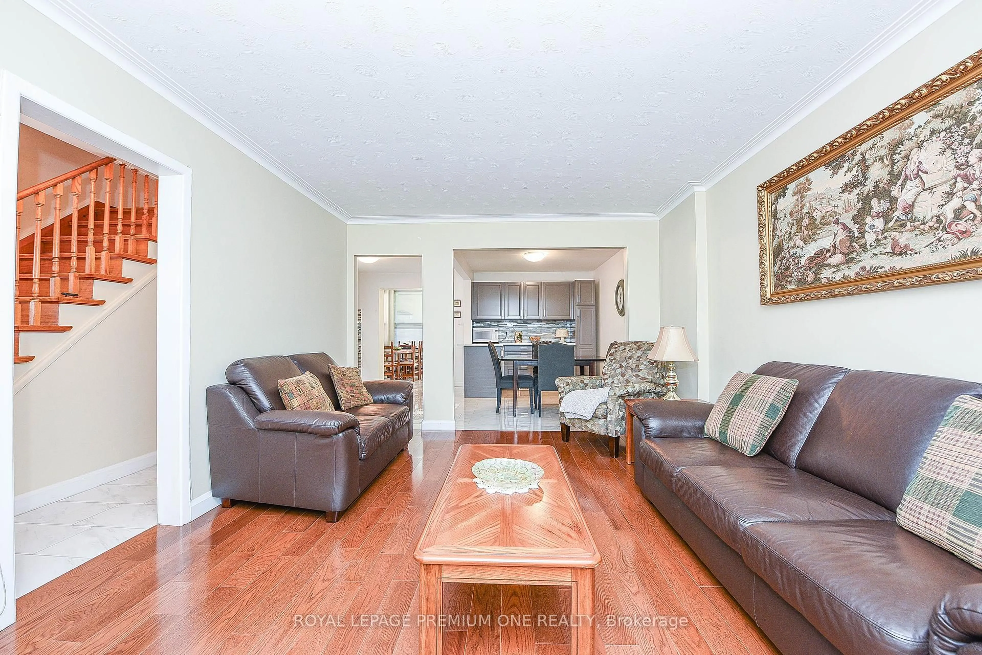Living room with furniture, wood/laminate floor for 63 Haverson Blvd, Toronto Ontario M6M 3J8