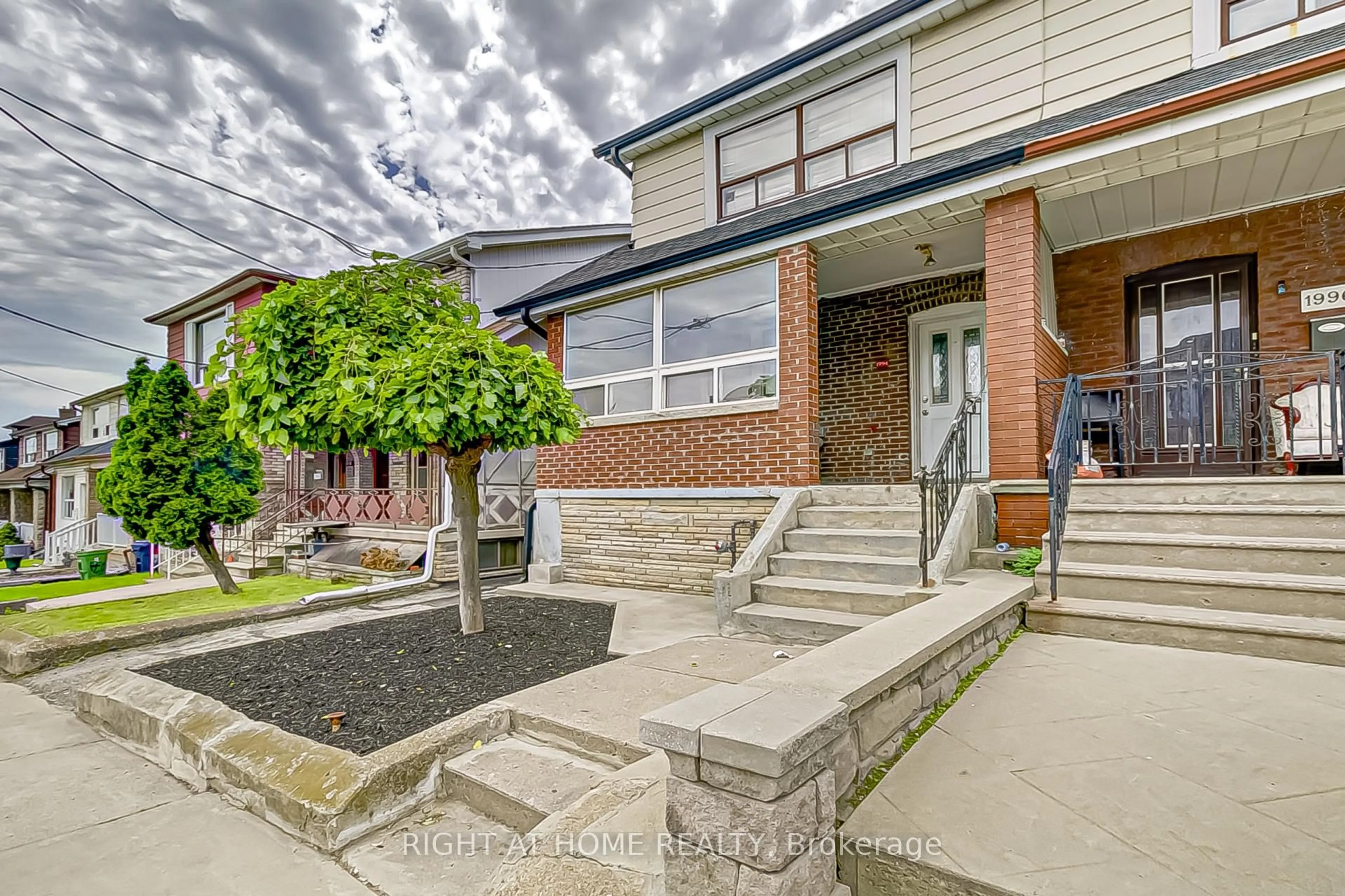 Home with brick exterior material, street for 1994 Dufferin St, Toronto Ontario M6E 3R2