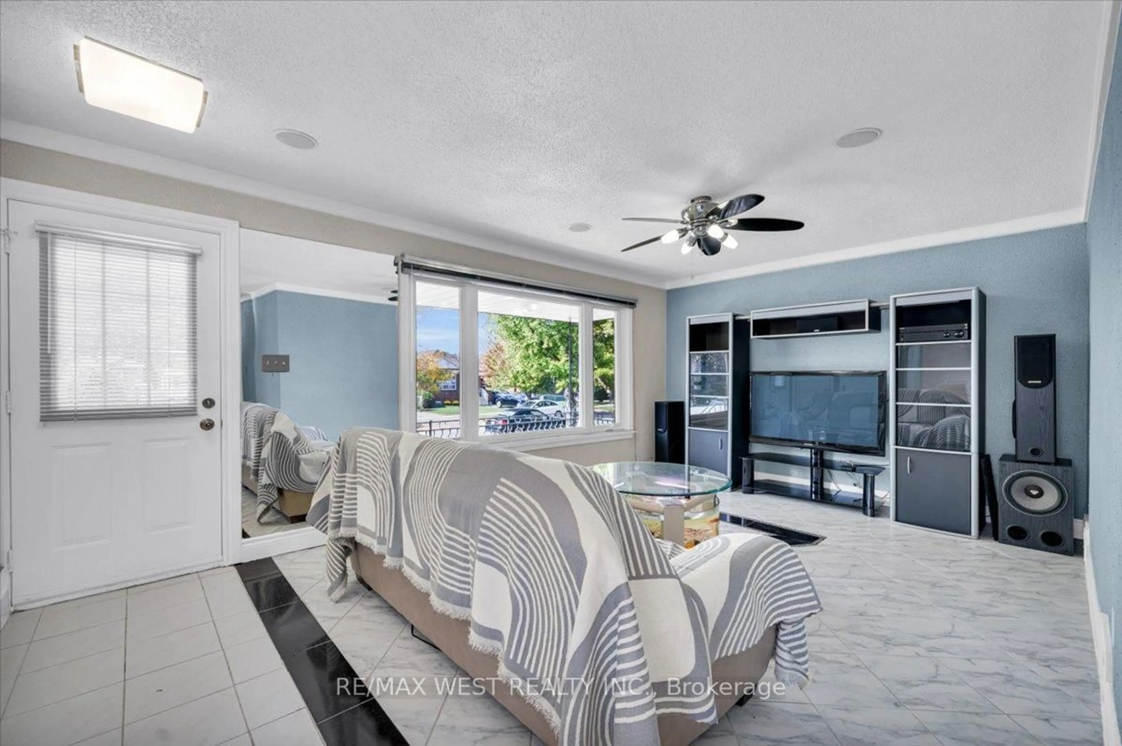 Living room with furniture, ceramic/tile floor for 233 Gamma St, Toronto Ontario M8W 4G7