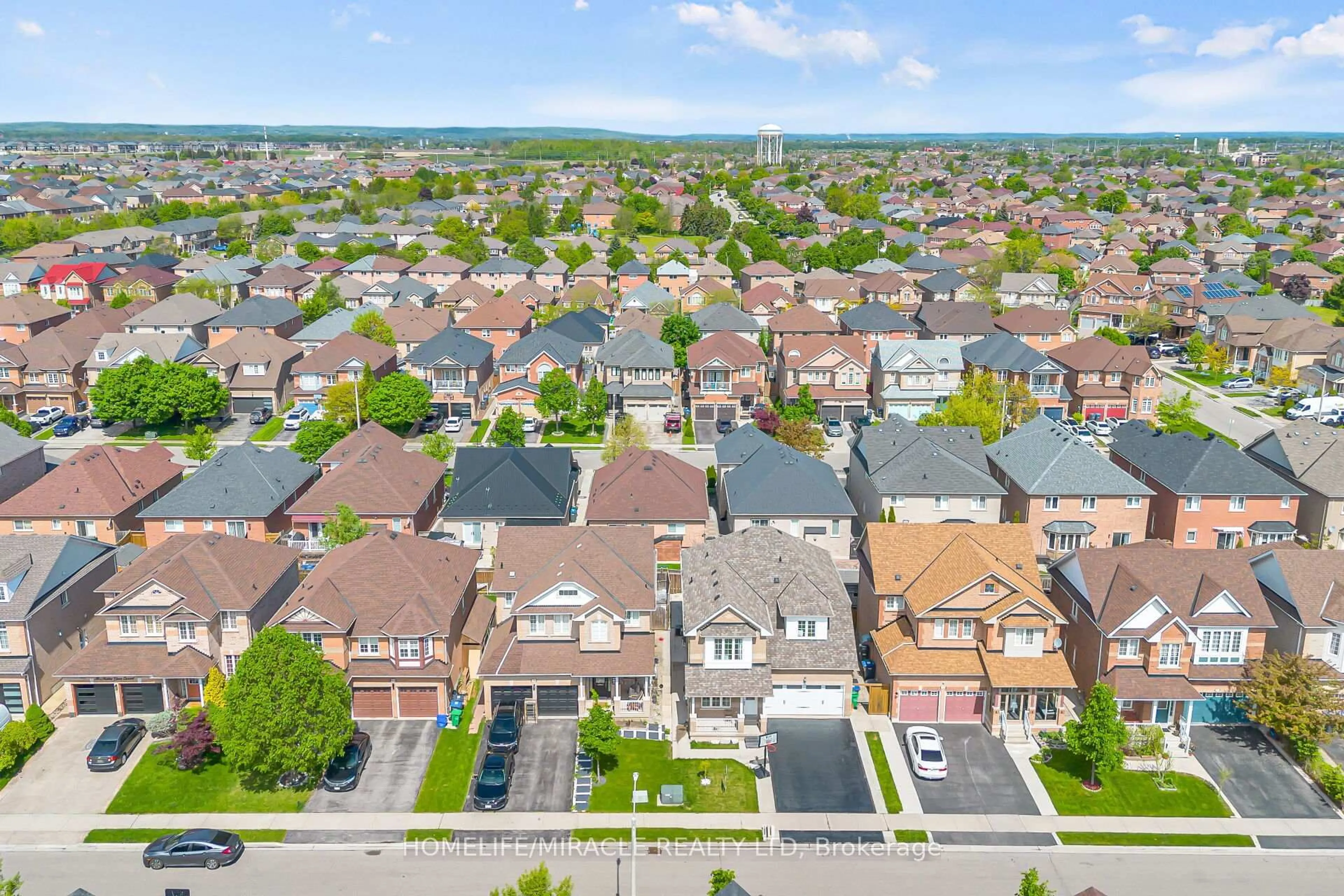 A pic from outside/outdoor area/front of a property/back of a property/a pic from drone, street for 98 Masters Green Cres, Brampton Ontario L7A 3K5