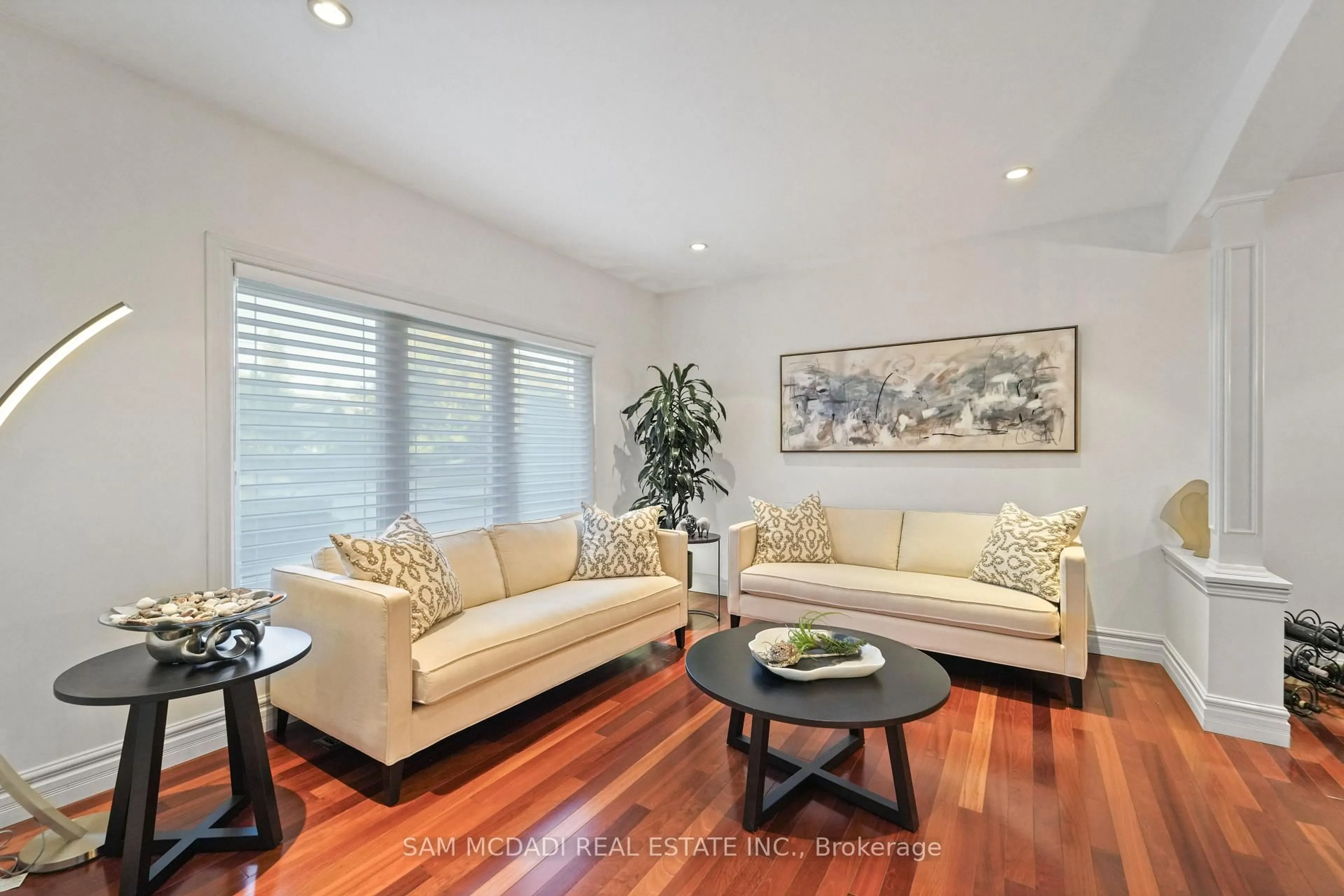 Living room with furniture, wood/laminate floor for 724 Atoka Dr, Mississauga Ontario L5H 1Y6