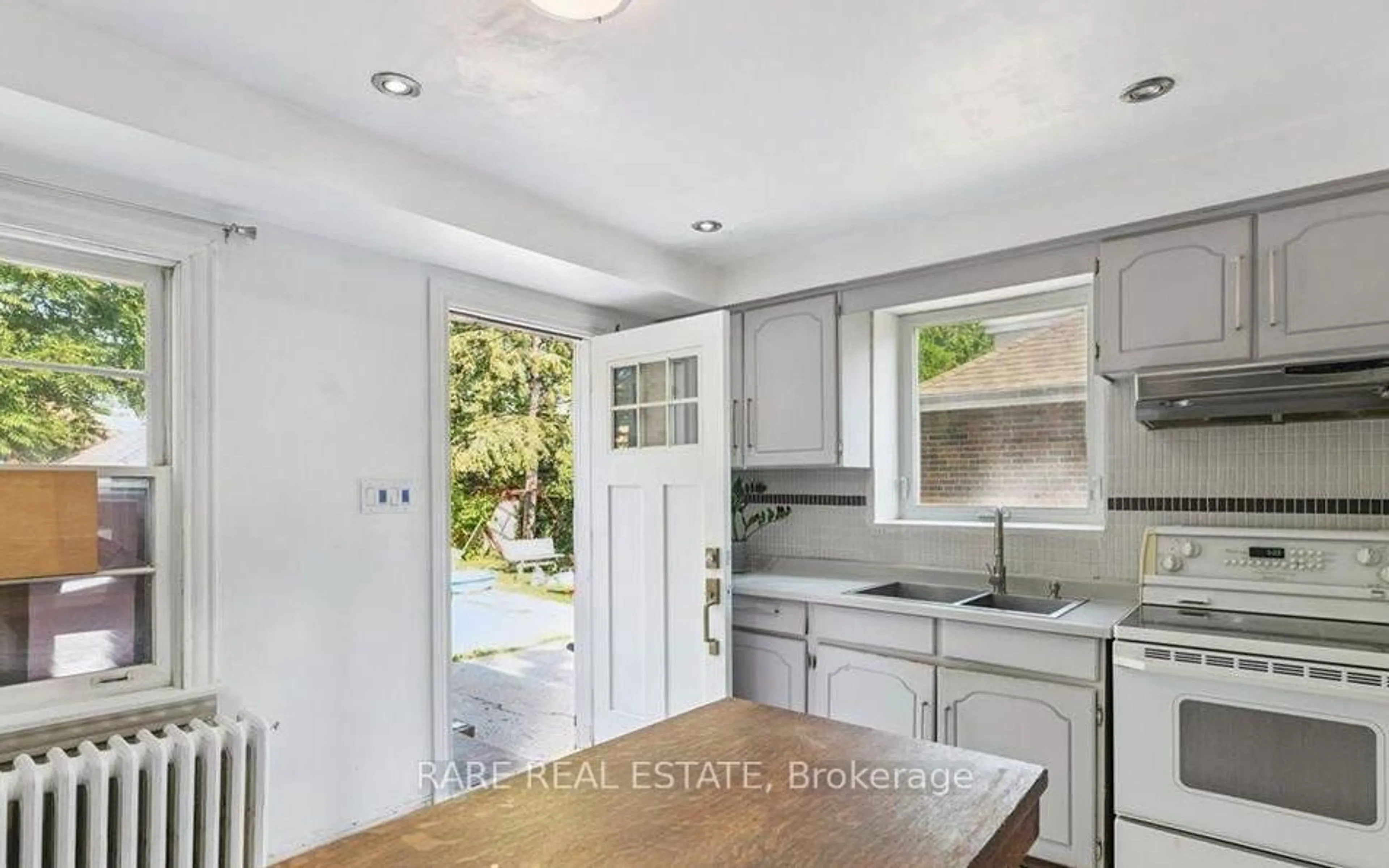Open concept kitchen, unknown for 73 Yarrow Rd, Toronto Ontario M6M 4E4