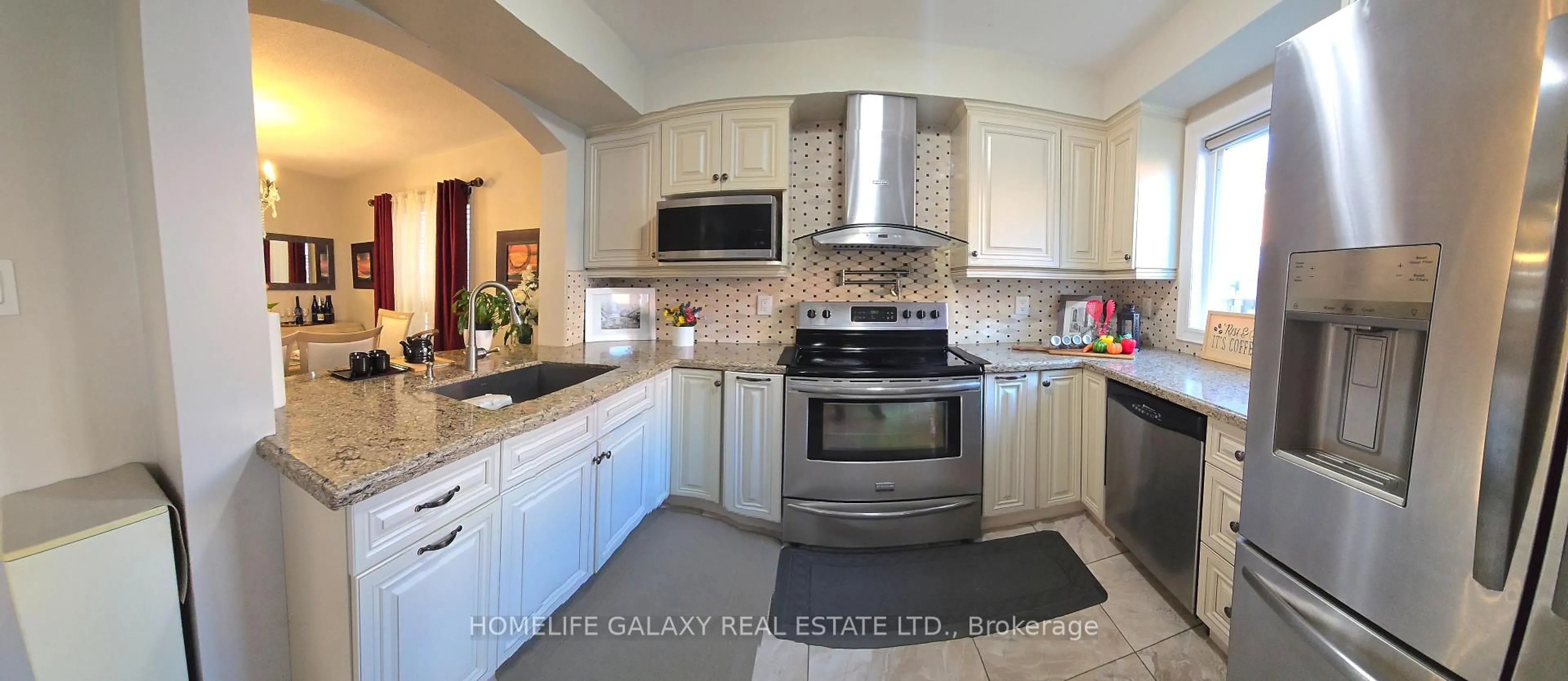 Open concept kitchen, ceramic/tile floor for 69 Crown Victoria Dr, Brampton Ontario L7A 3X1
