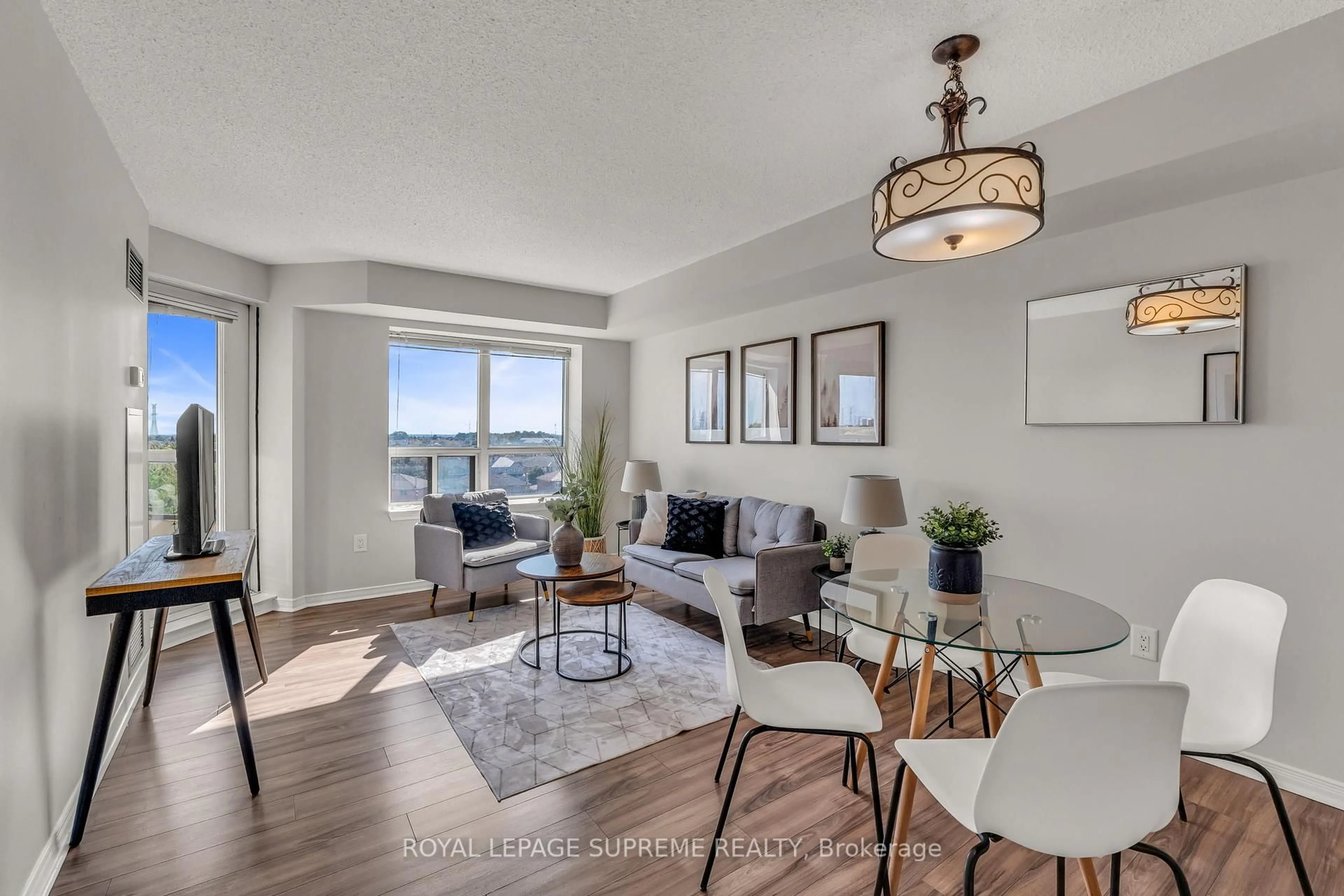Living room with furniture, wood/laminate floor for 300 Ray Lawson Blvd #601, Brampton Ontario L6Y 5H5