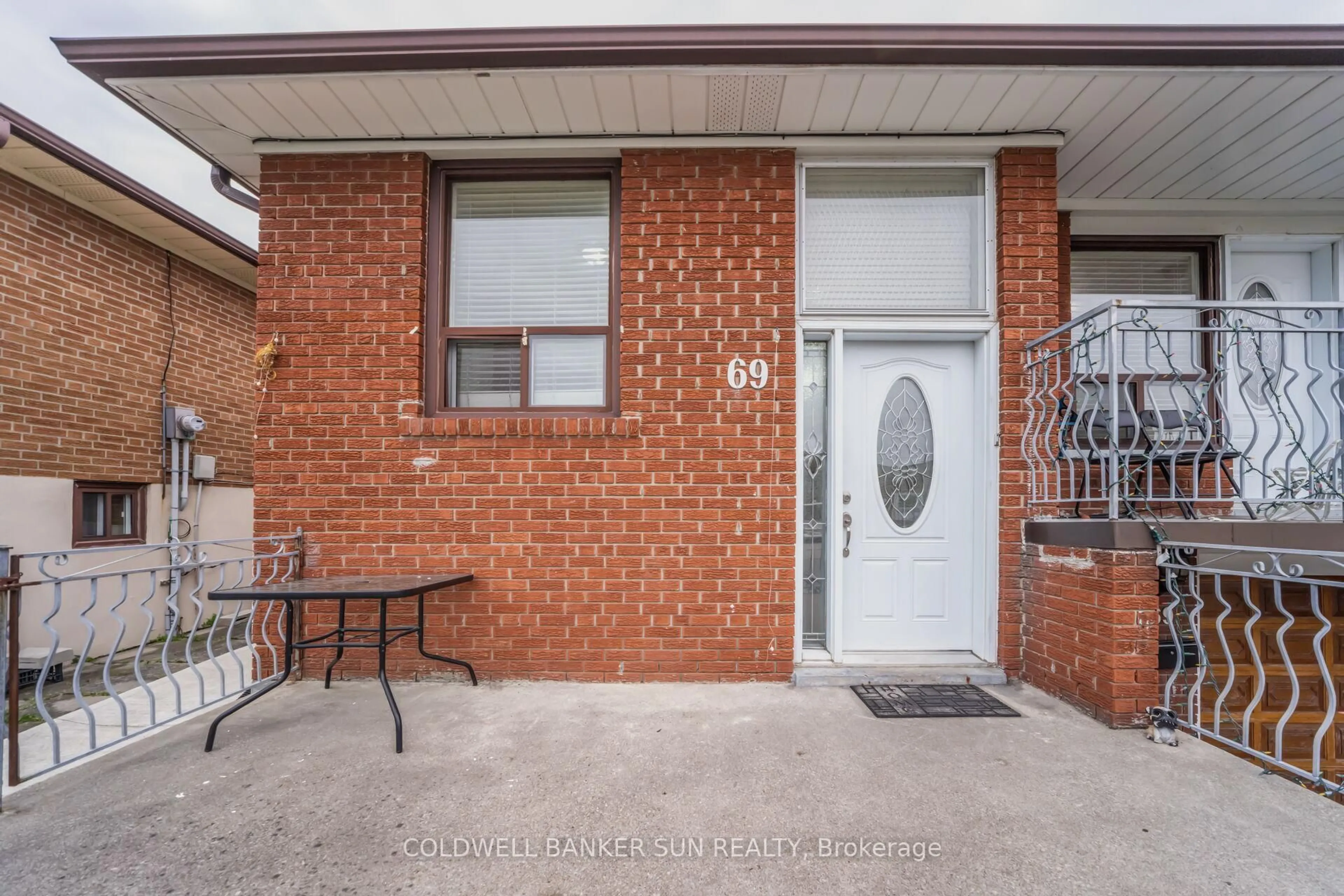 Home with brick exterior material, street for 69 Songwood Dr, Toronto Ontario M9M 1X4
