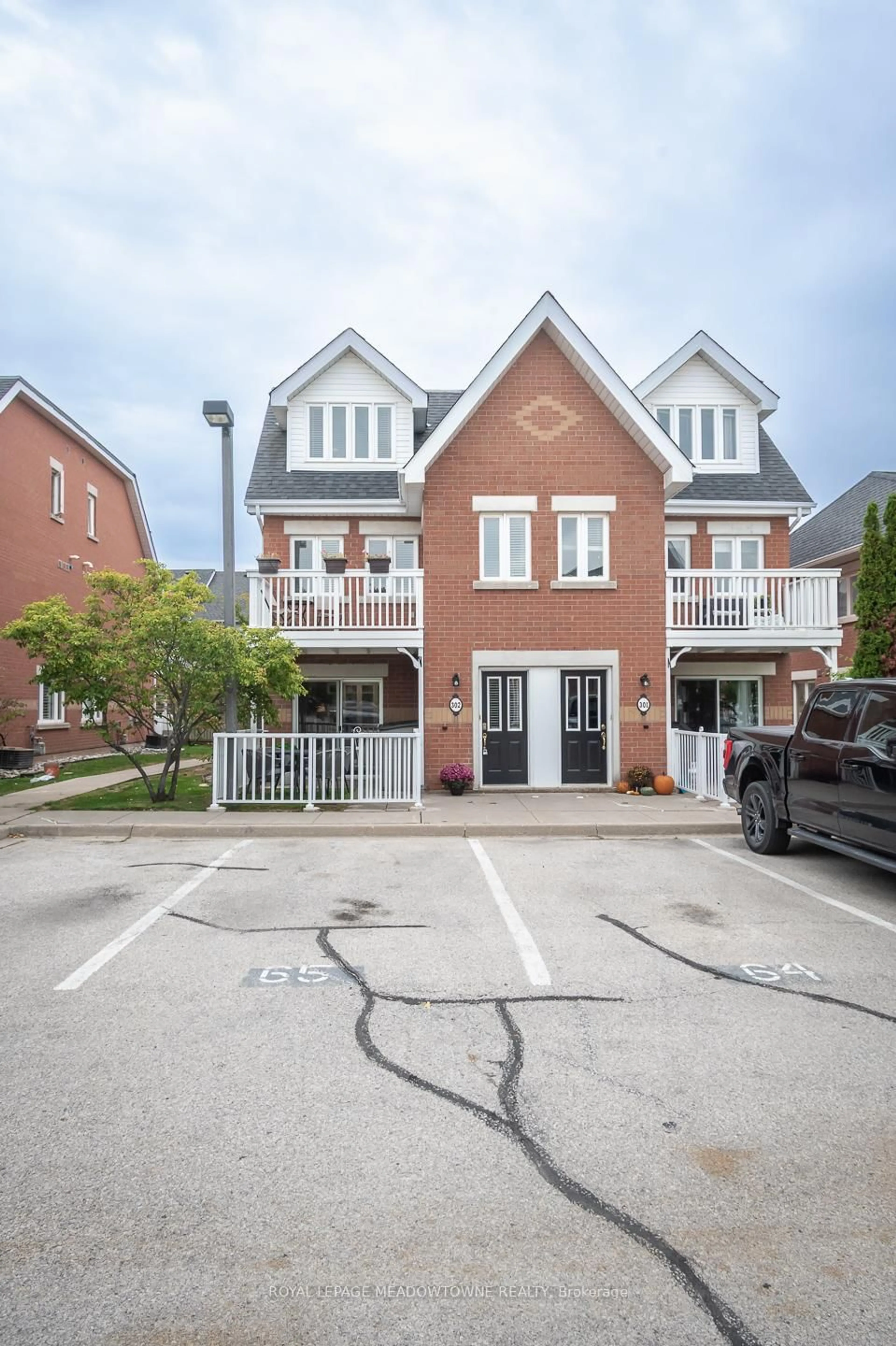Home with brick exterior material, street for 1701 Lampman Ave #302, Burlington Ontario L7L 6R7