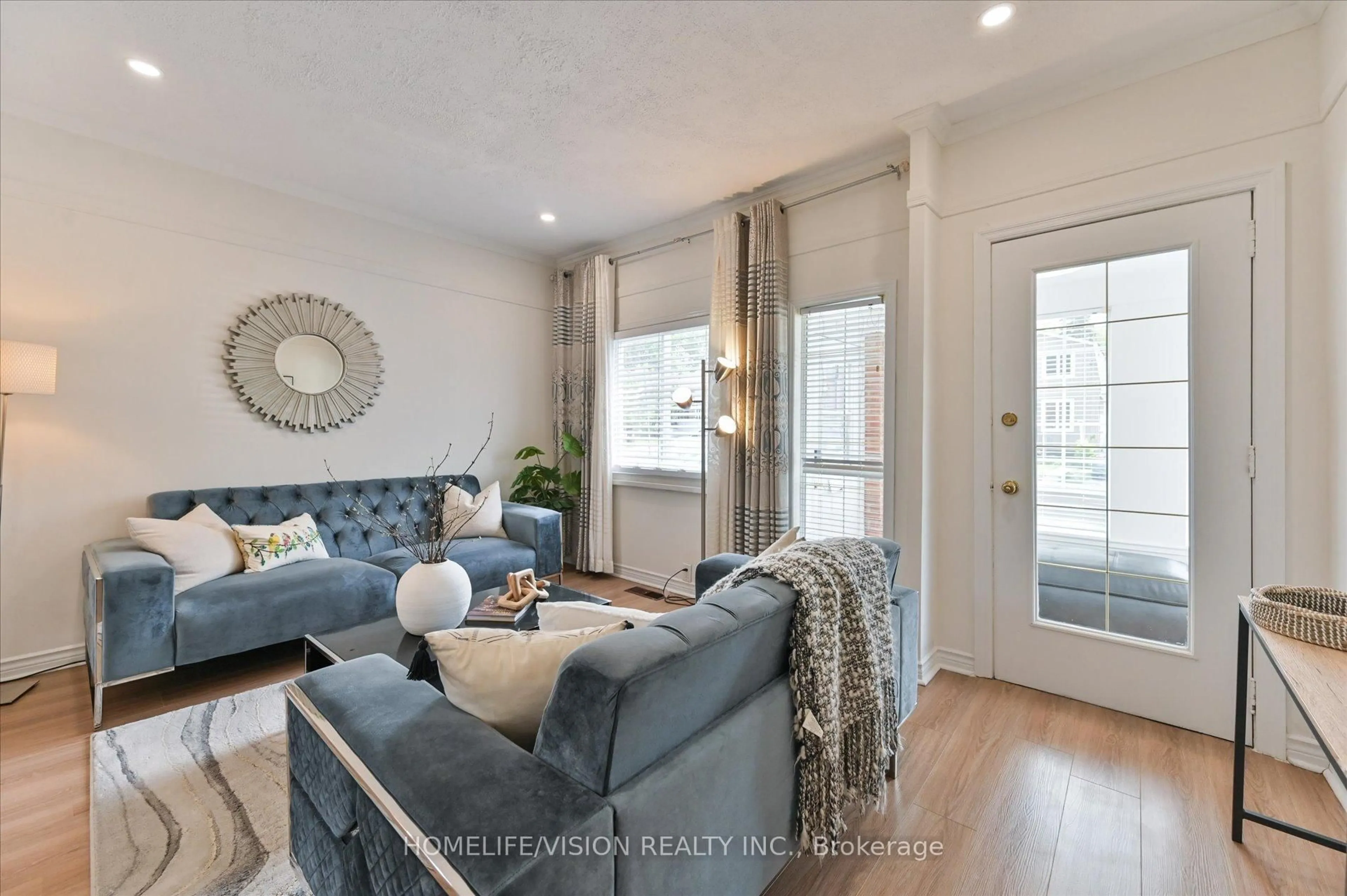 Living room with furniture, wood/laminate floor for 406 Nairn Ave, Toronto Ontario M6E 4J3