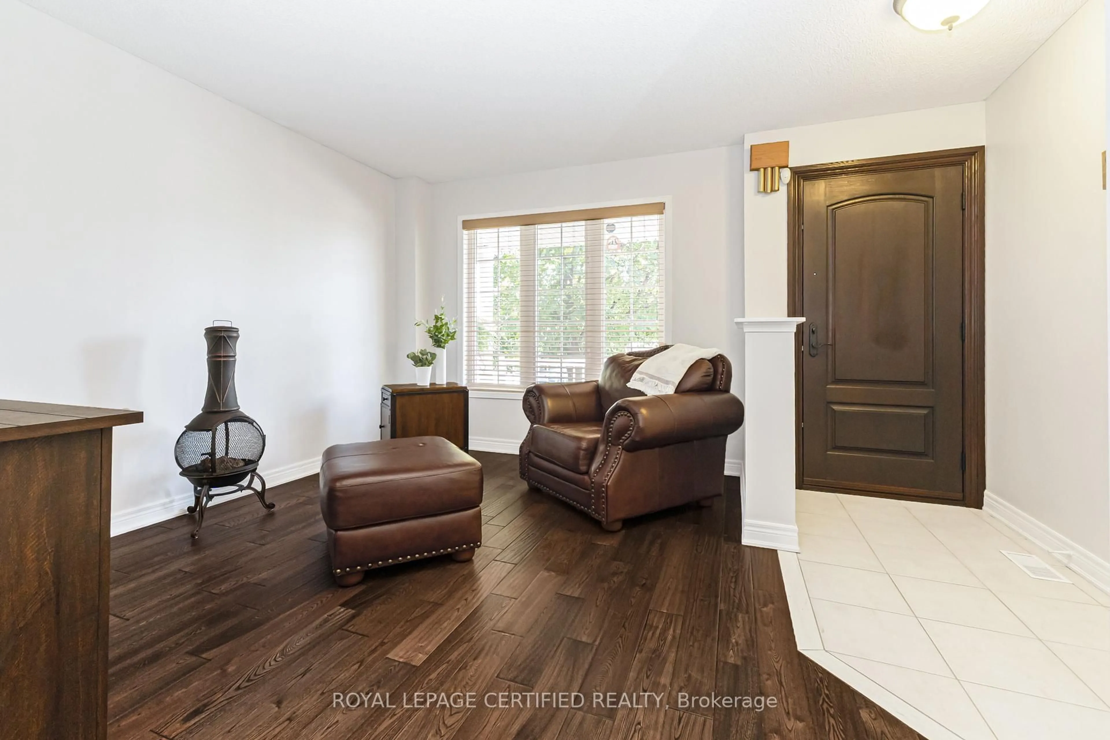 Living room with furniture, wood/laminate floor for 43 Heatherdale Dr, Brampton Ontario L7A 2H4