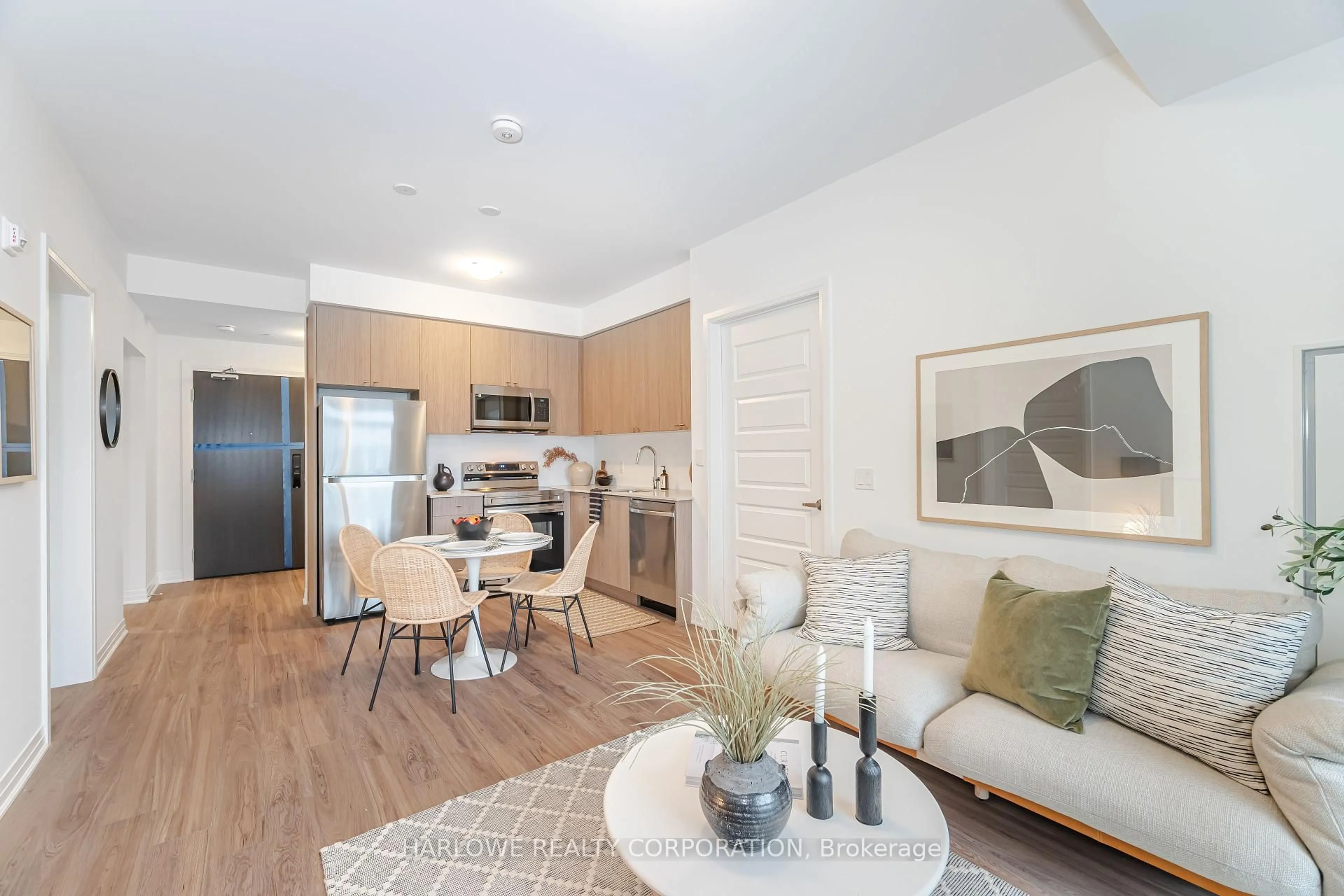 Open concept kitchen, wood/laminate floor for 490 Gordon Krantz Ave #513, Milton Ontario L9E 1Z4