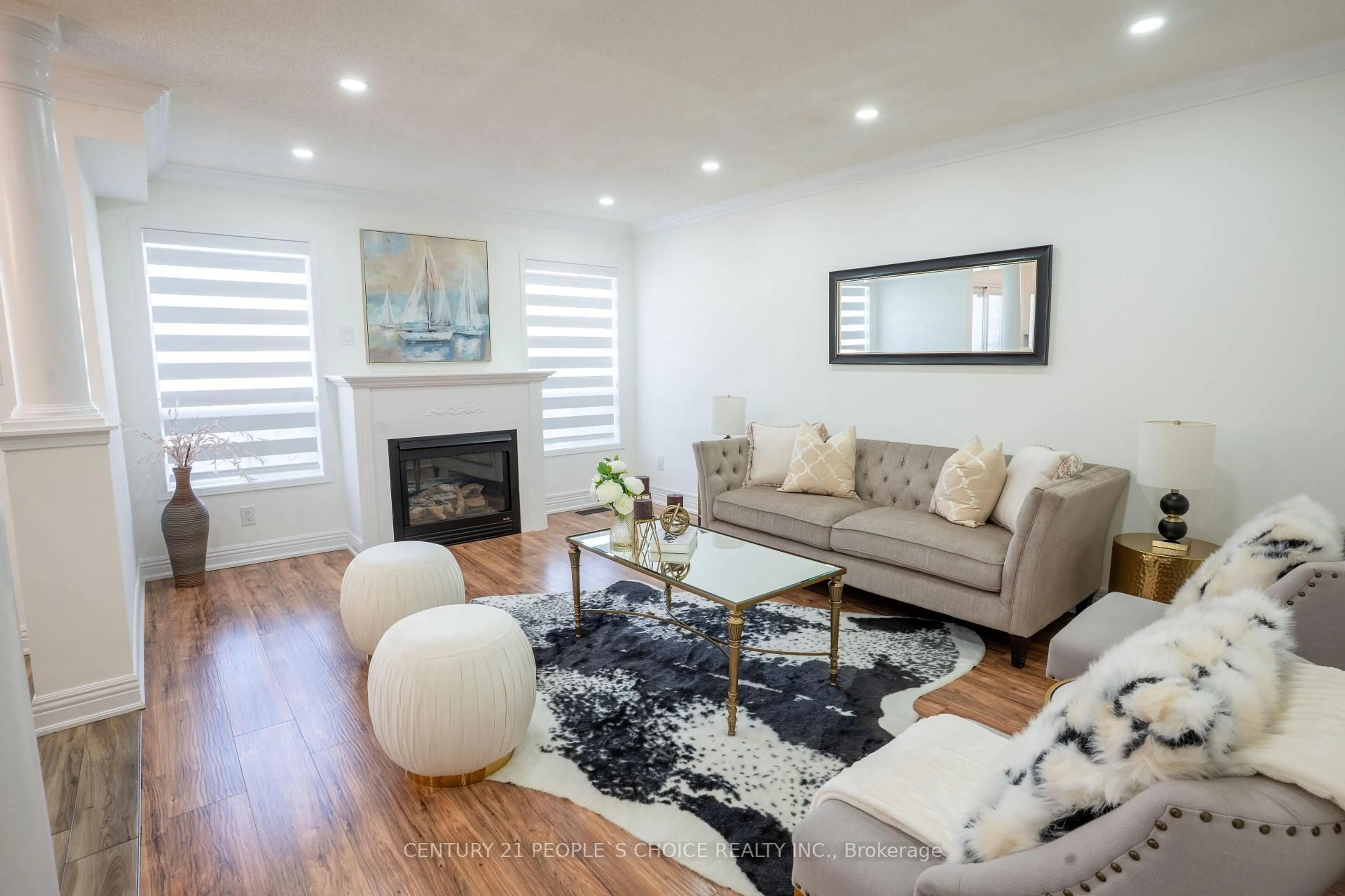 Living room with furniture, wood/laminate floor for 111 Brisdale Dr, Brampton Ontario L7A 2H2