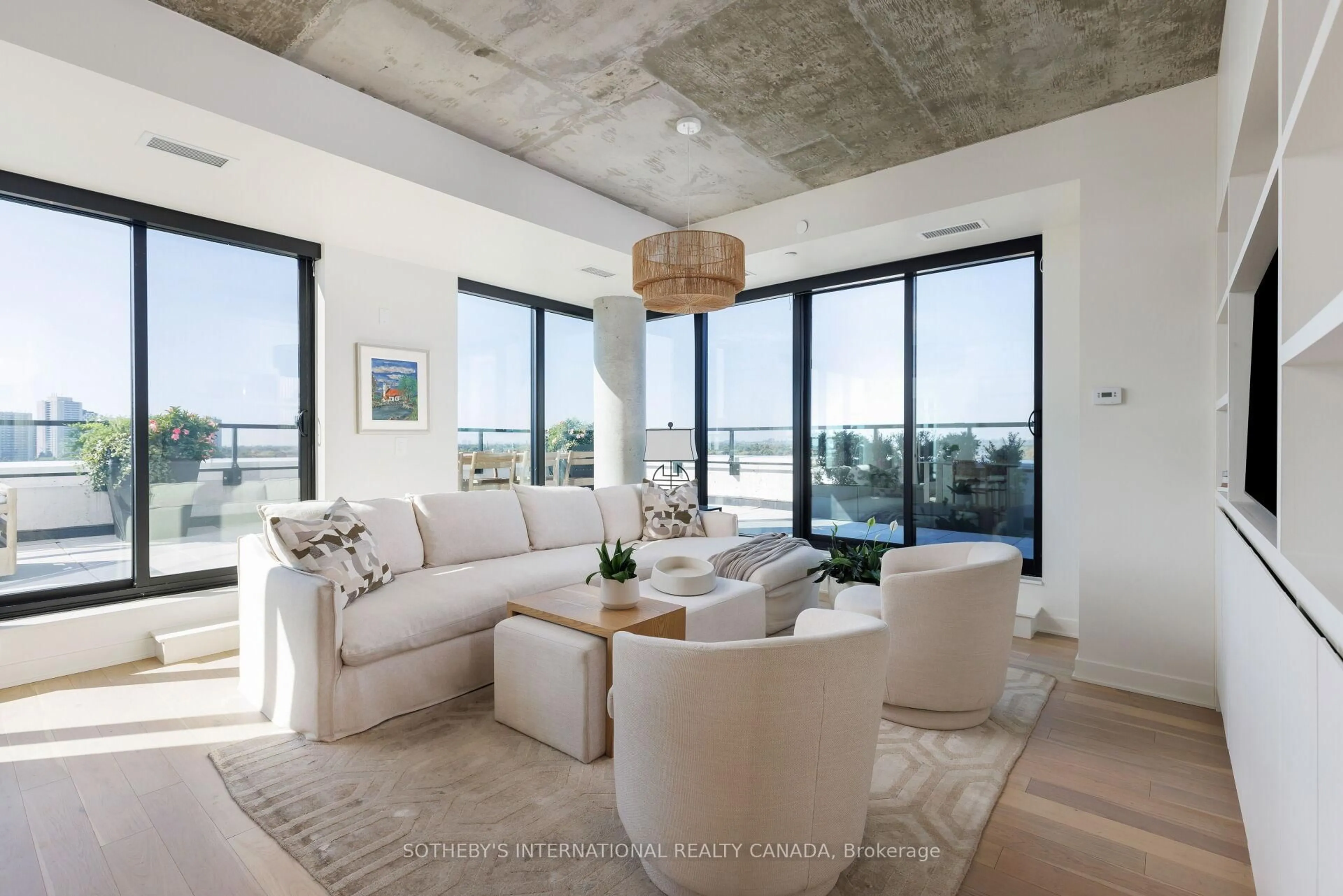 Living room with furniture, cement floor for 2720 Dundas St #903, Toronto Ontario M6P 0C3
