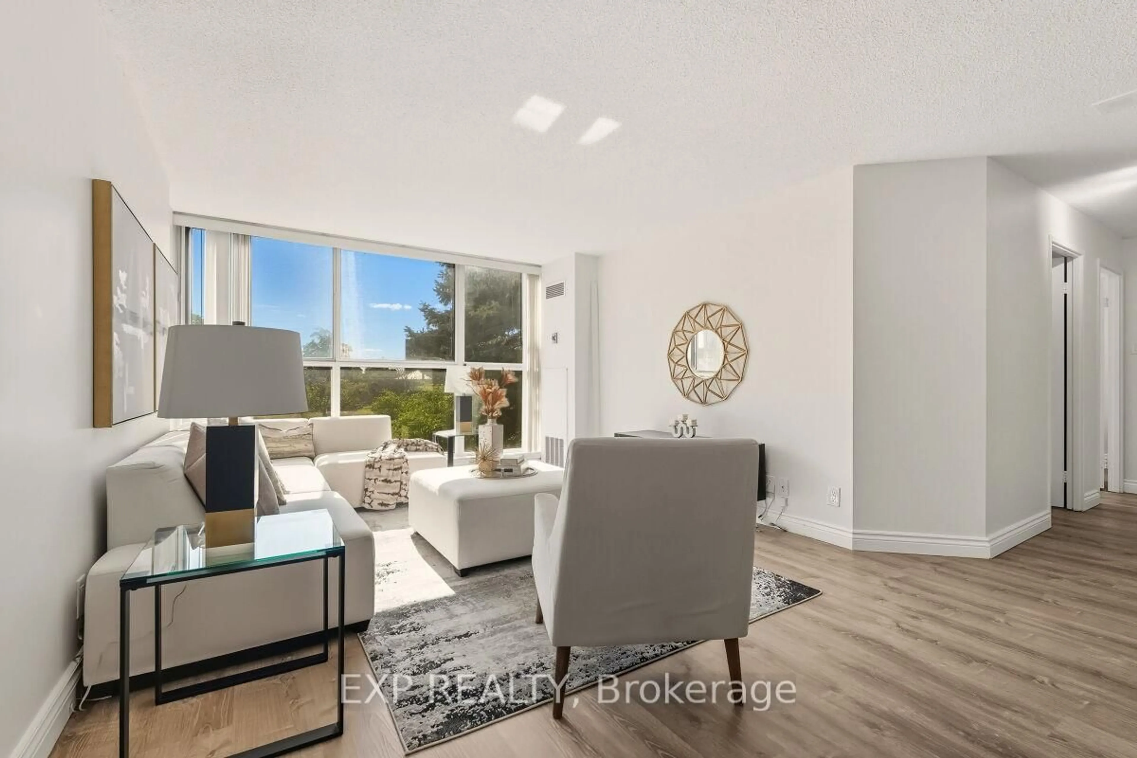 Living room with furniture, unknown for 35 Trailwood Dr #217, Mississauga Ontario L4Z 3L6