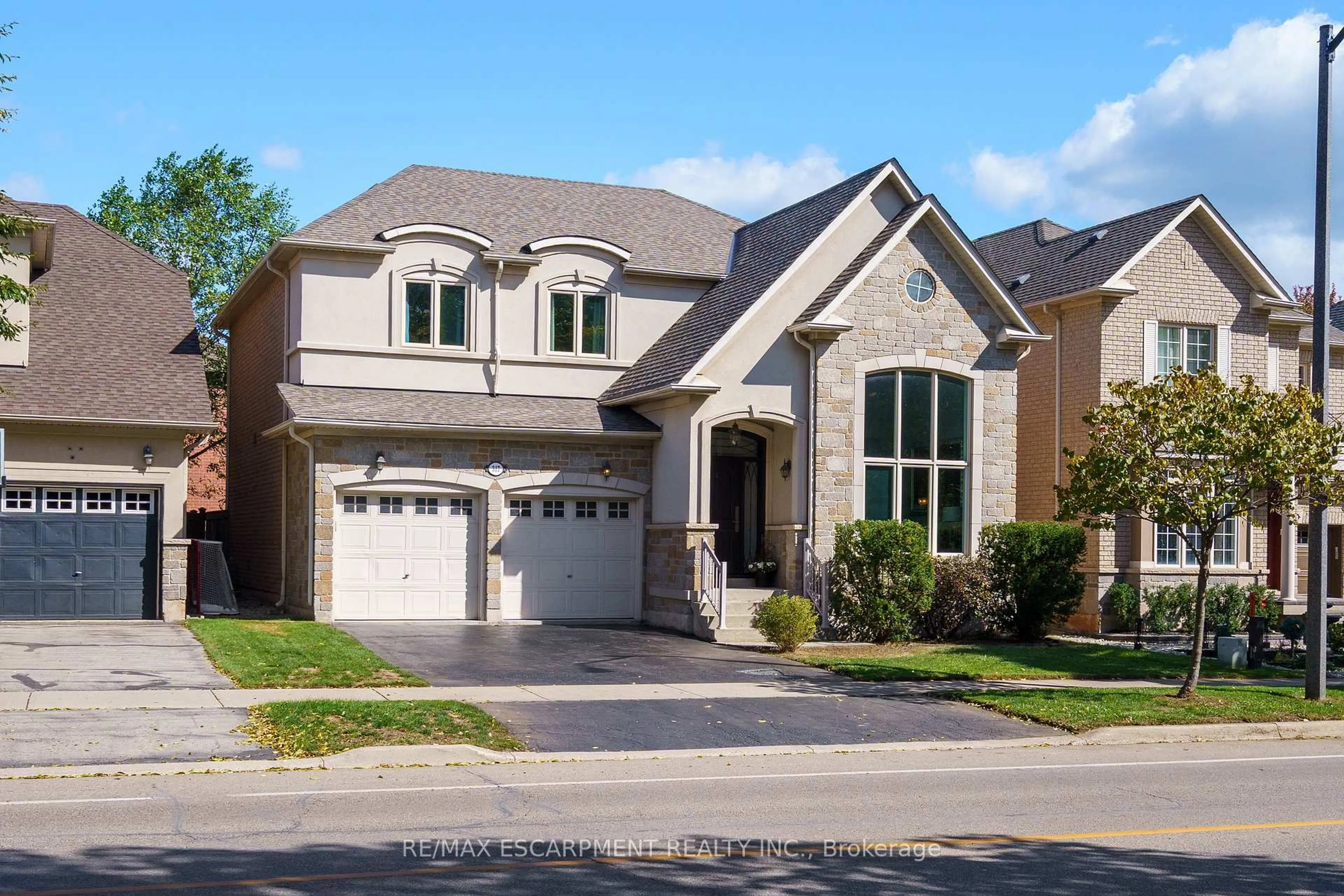 Home with brick exterior material, street for 317 Great Lakes Blvd, Oakville Ontario L6L 0A4