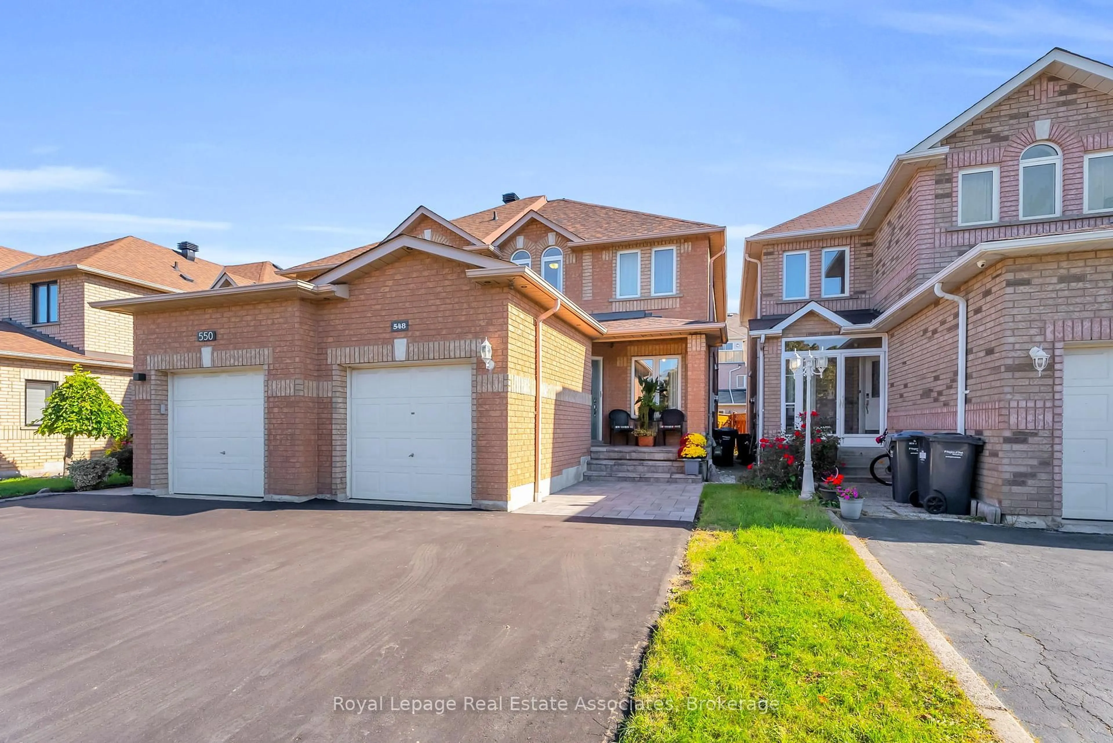 Home with brick exterior material, street for 548 Leatherleaf Dr, Mississauga Ontario L4Z 3Y5
