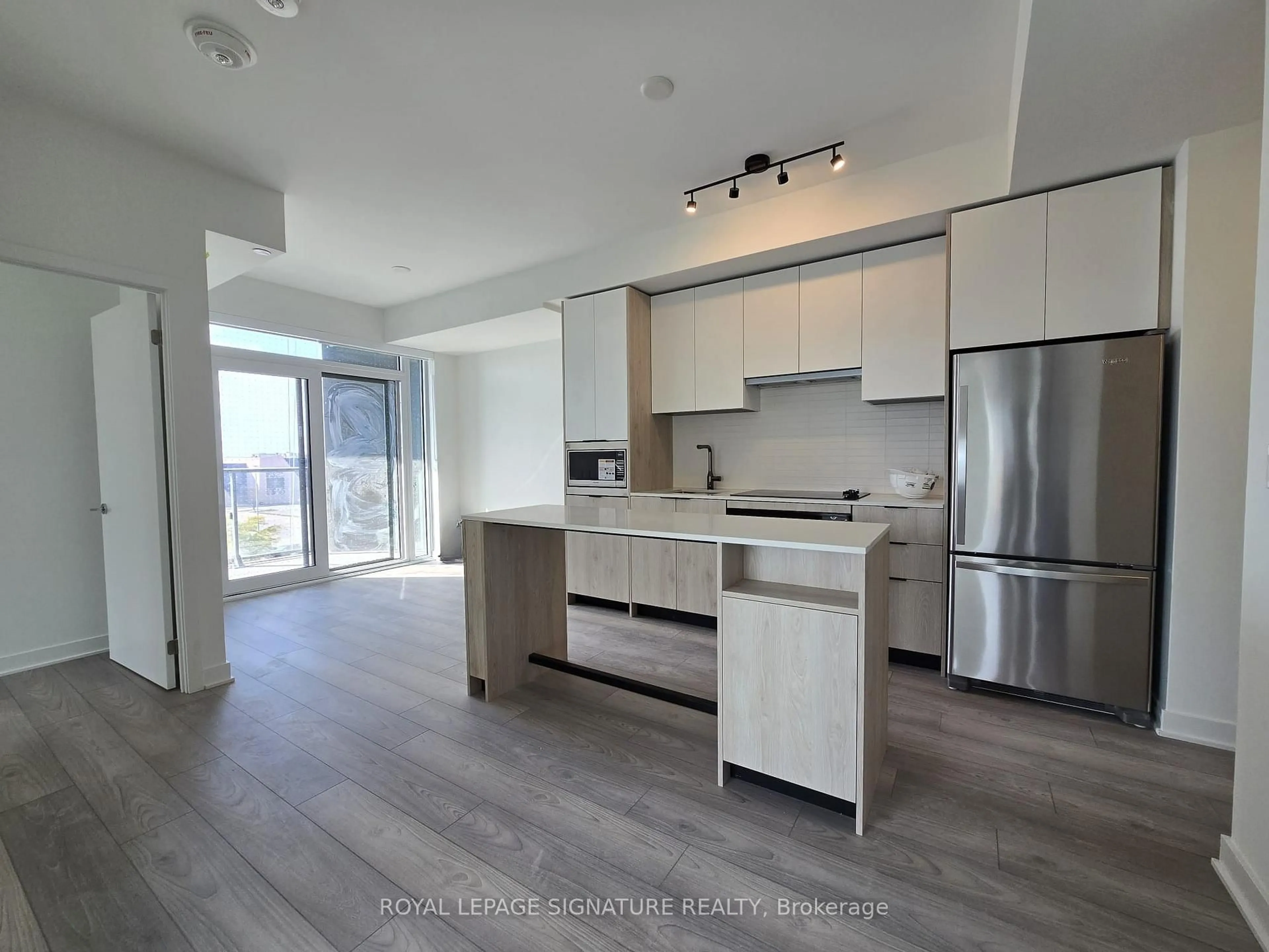 Open concept kitchen, wood/laminate floor for 1007 The Queensway Ave #314, Toronto Ontario M8Z 0H4