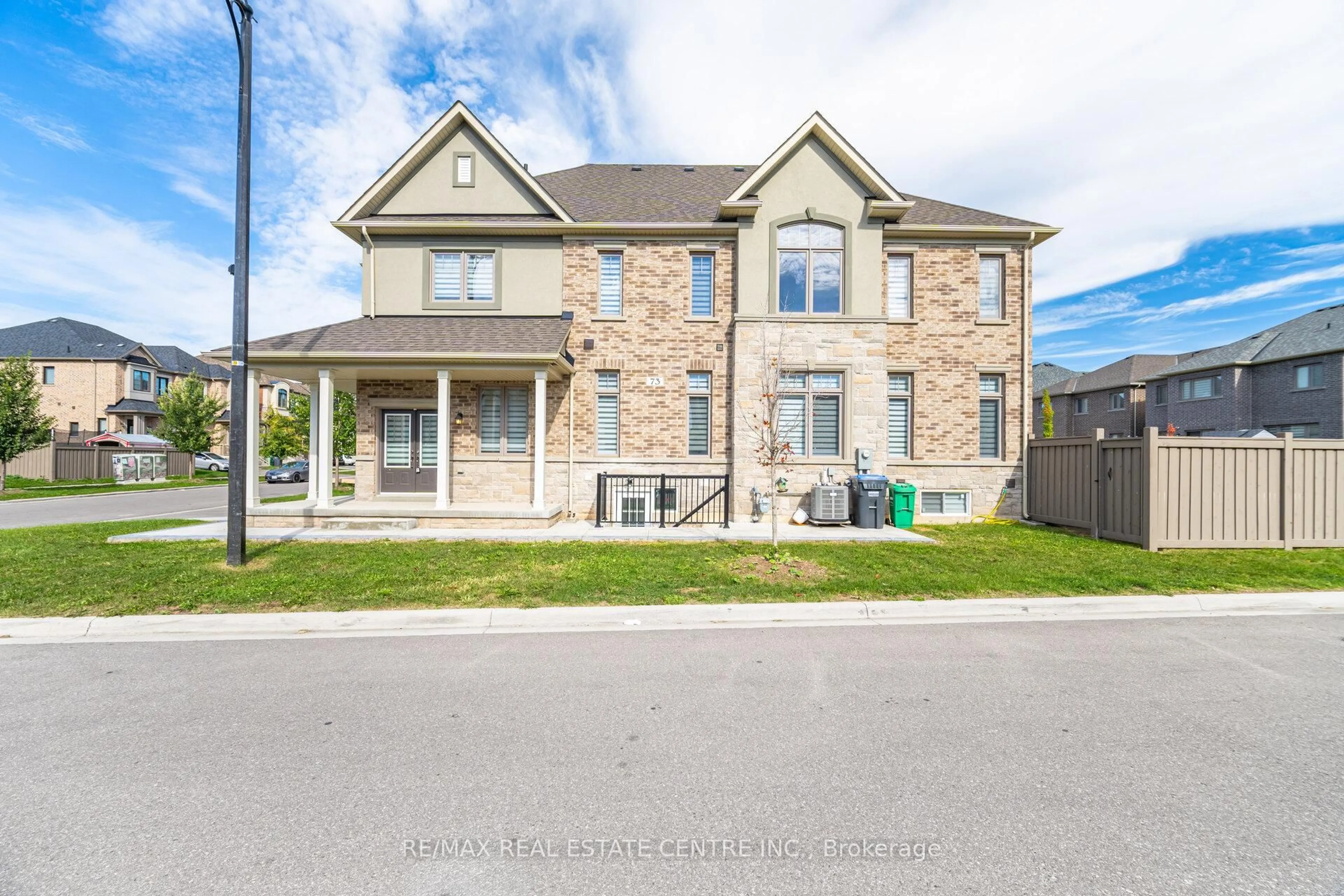 Home with brick exterior material, street for 73 Brushwood Dr, Brampton Ontario L6Y 6J4