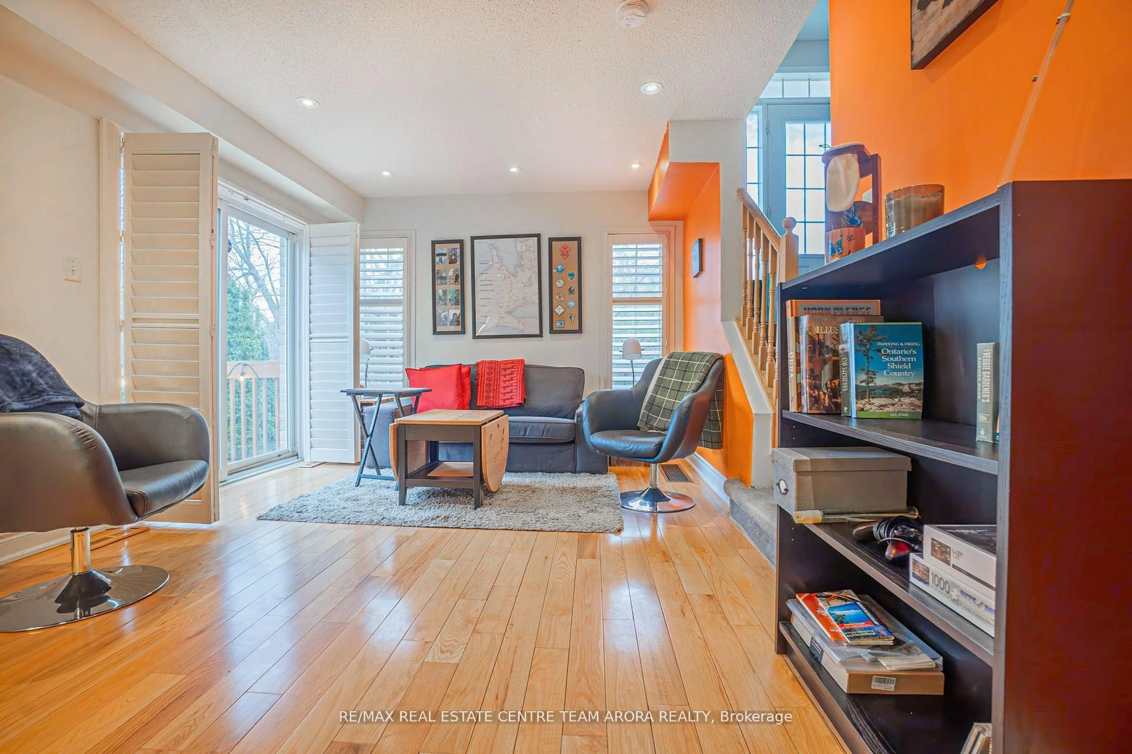 Living room with furniture, wood/laminate floor for 67 Axelrod Ave, Brampton Ontario L6Y 5S9