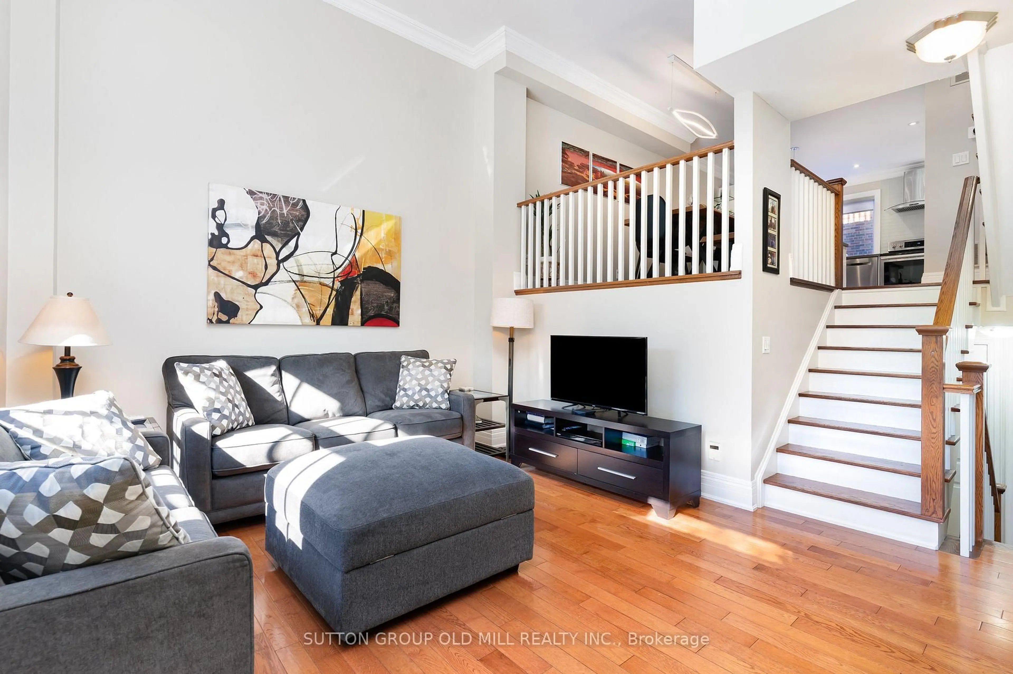 Living room with furniture, wood/laminate floor for 4 Hunter Ave, Toronto Ontario M6E 2C8