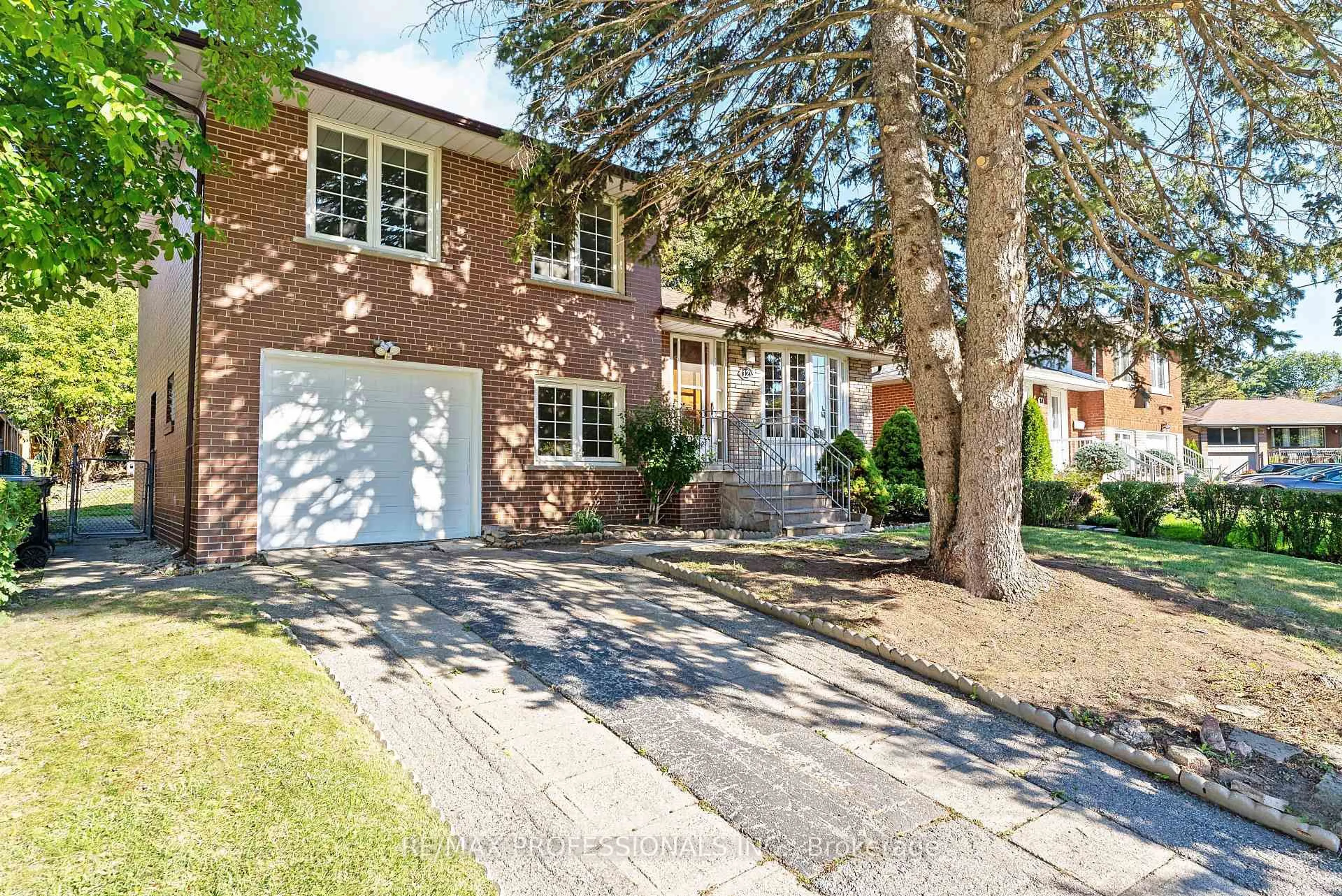 Home with brick exterior material, street for 12 Drury Lane, Toronto Ontario M9P 1P7