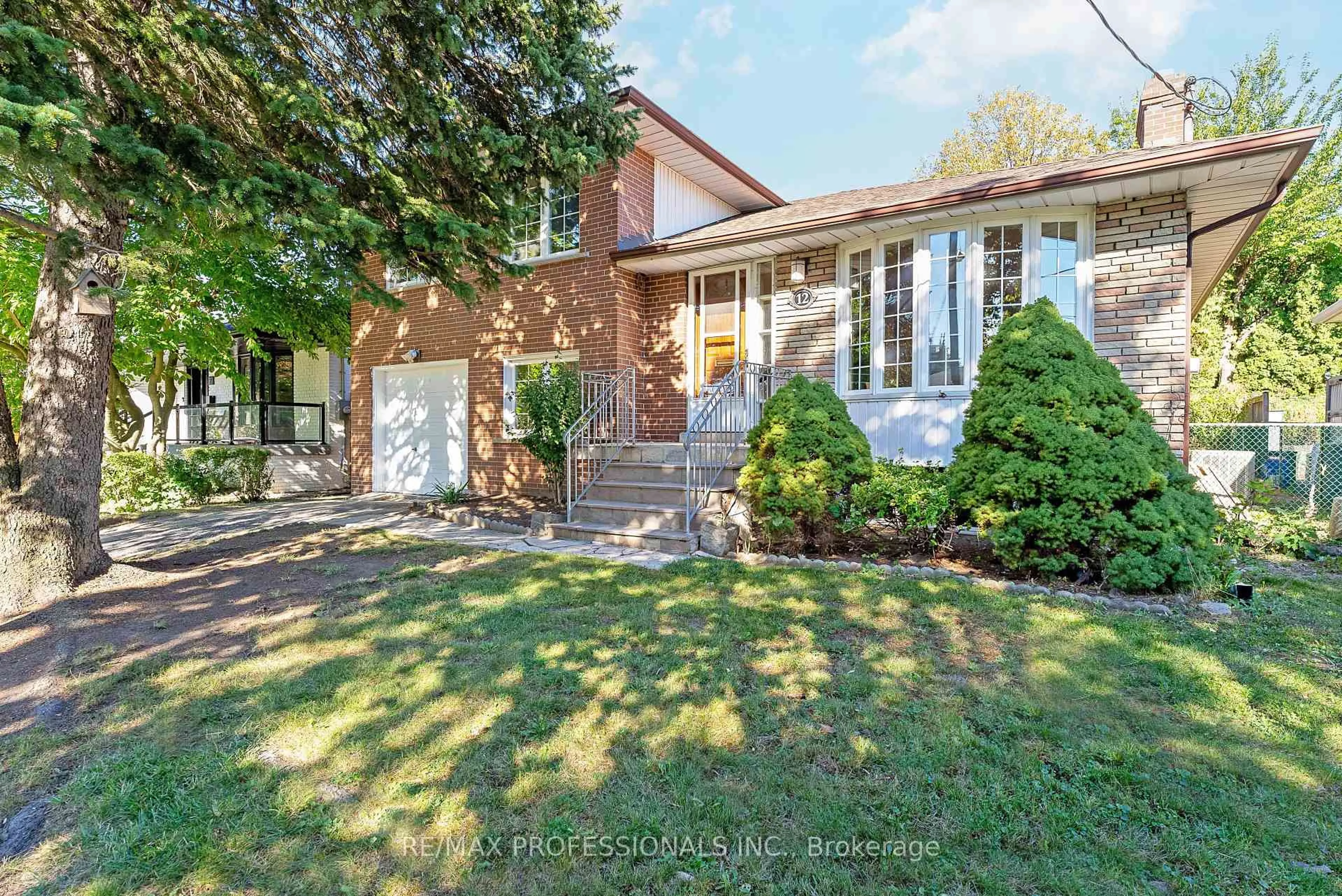 Home with brick exterior material, street for 12 Drury Lane, Toronto Ontario M9P 1P7