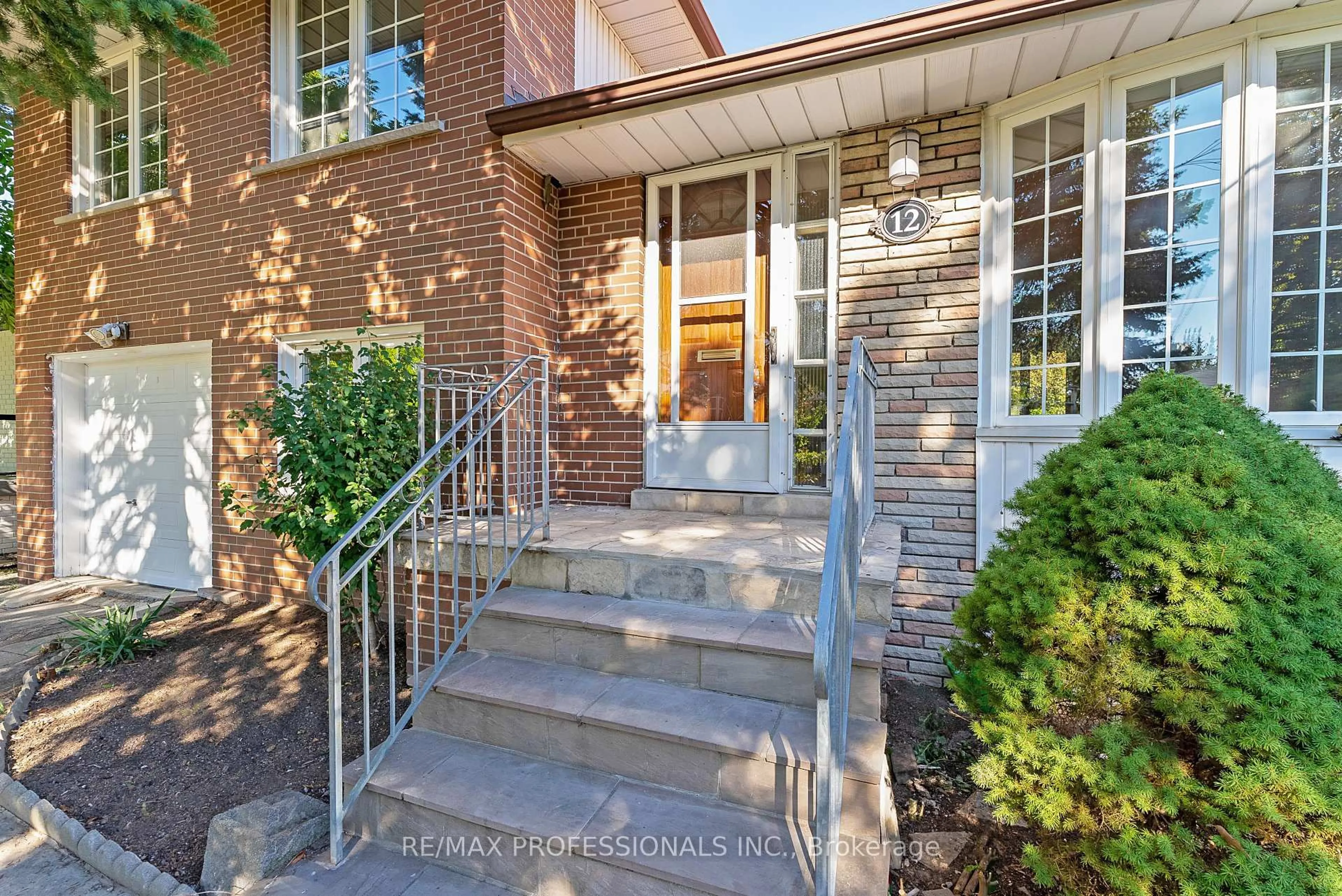 Home with brick exterior material, street for 12 Drury Lane, Toronto Ontario M9P 1P7