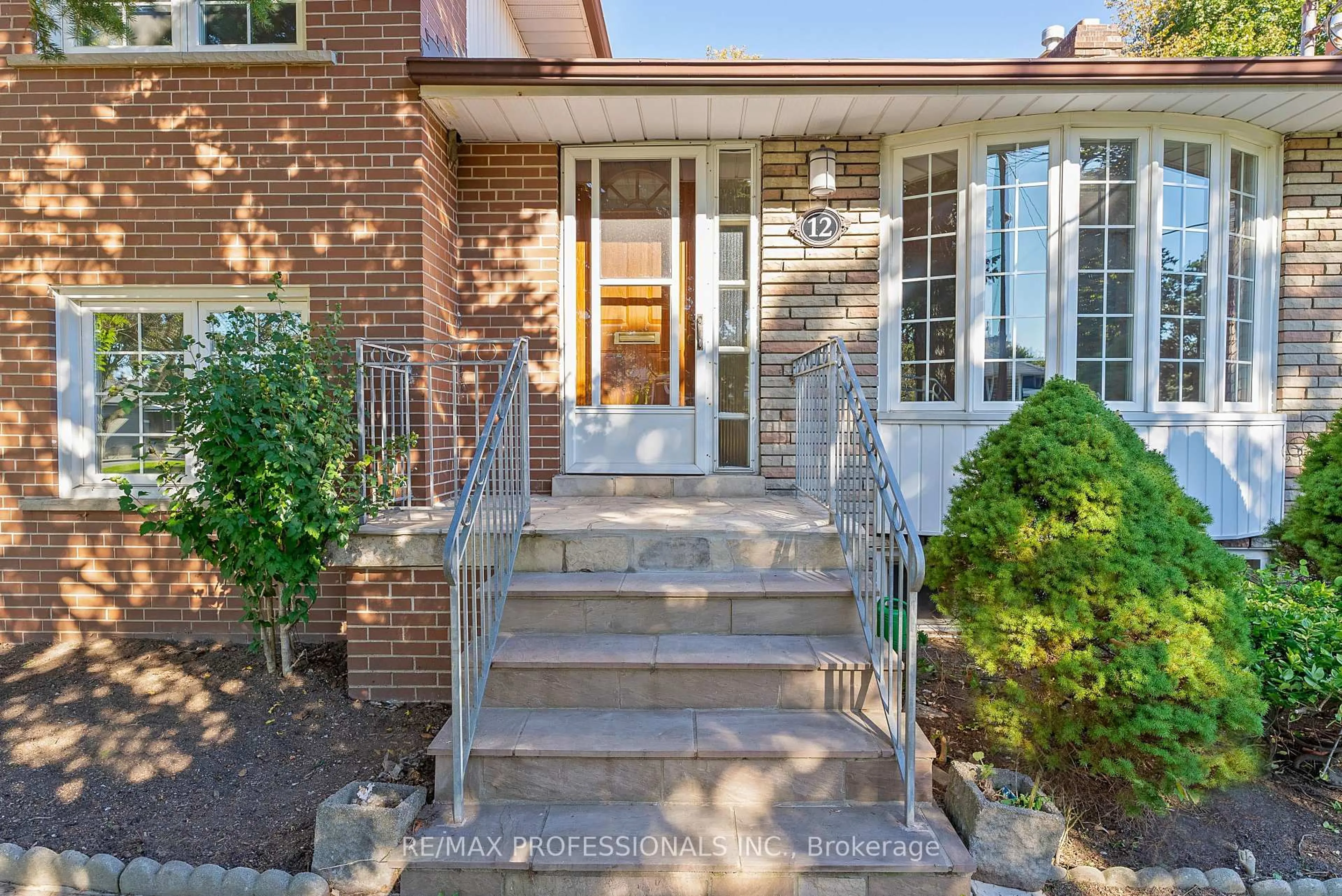 Home with brick exterior material, street for 12 Drury Lane, Toronto Ontario M9P 1P7