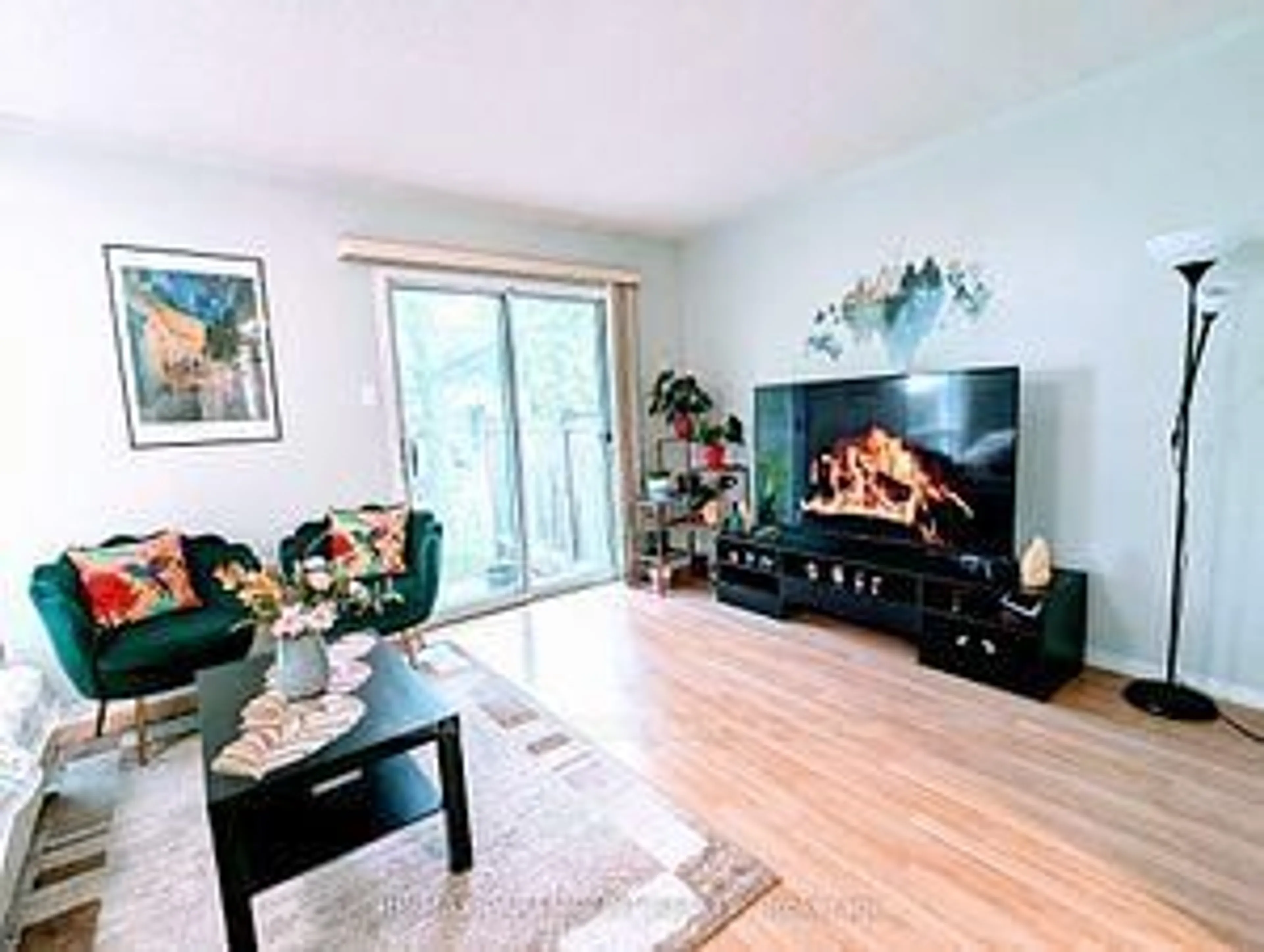 Living room with furniture, wood/laminate floor for 37 Wickstead Crt, Brampton Ontario L6R 1N8