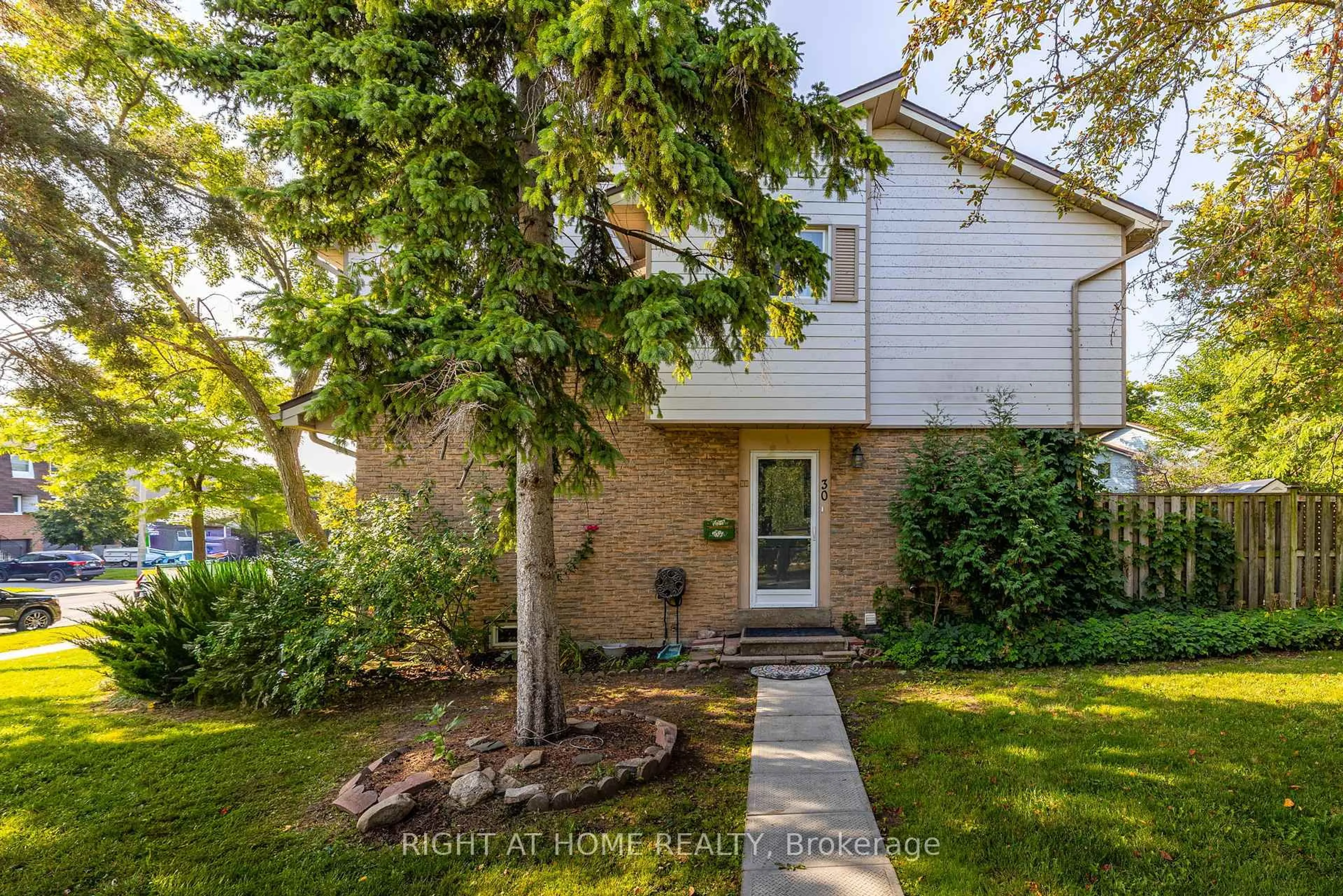 Home with brick exterior material, street for 6540 Falconer Dr #30, Mississauga Ontario L5N 1M1