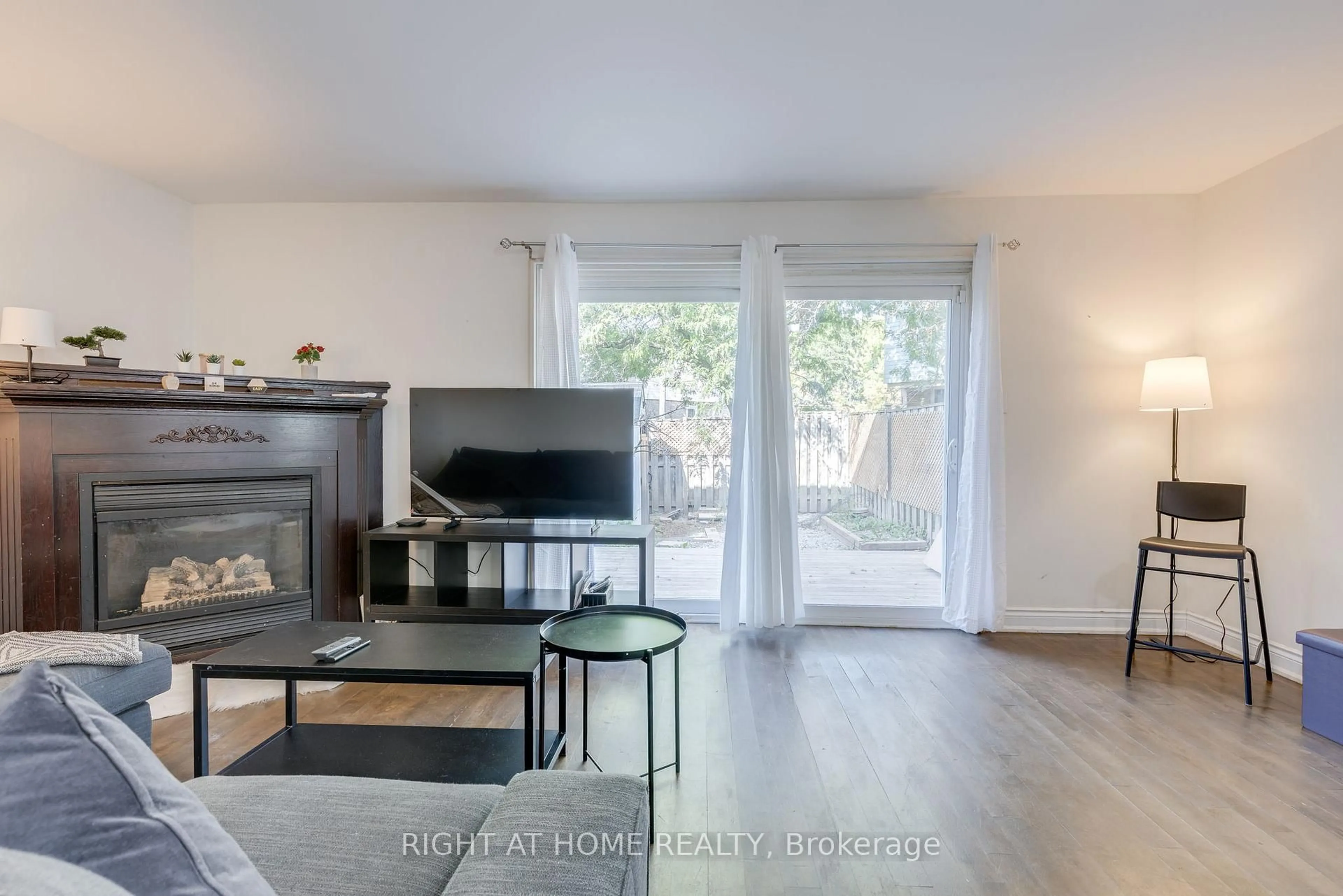 Living room with furniture, wood/laminate floor for 6540 Falconer Dr #30, Mississauga Ontario L5N 1M1