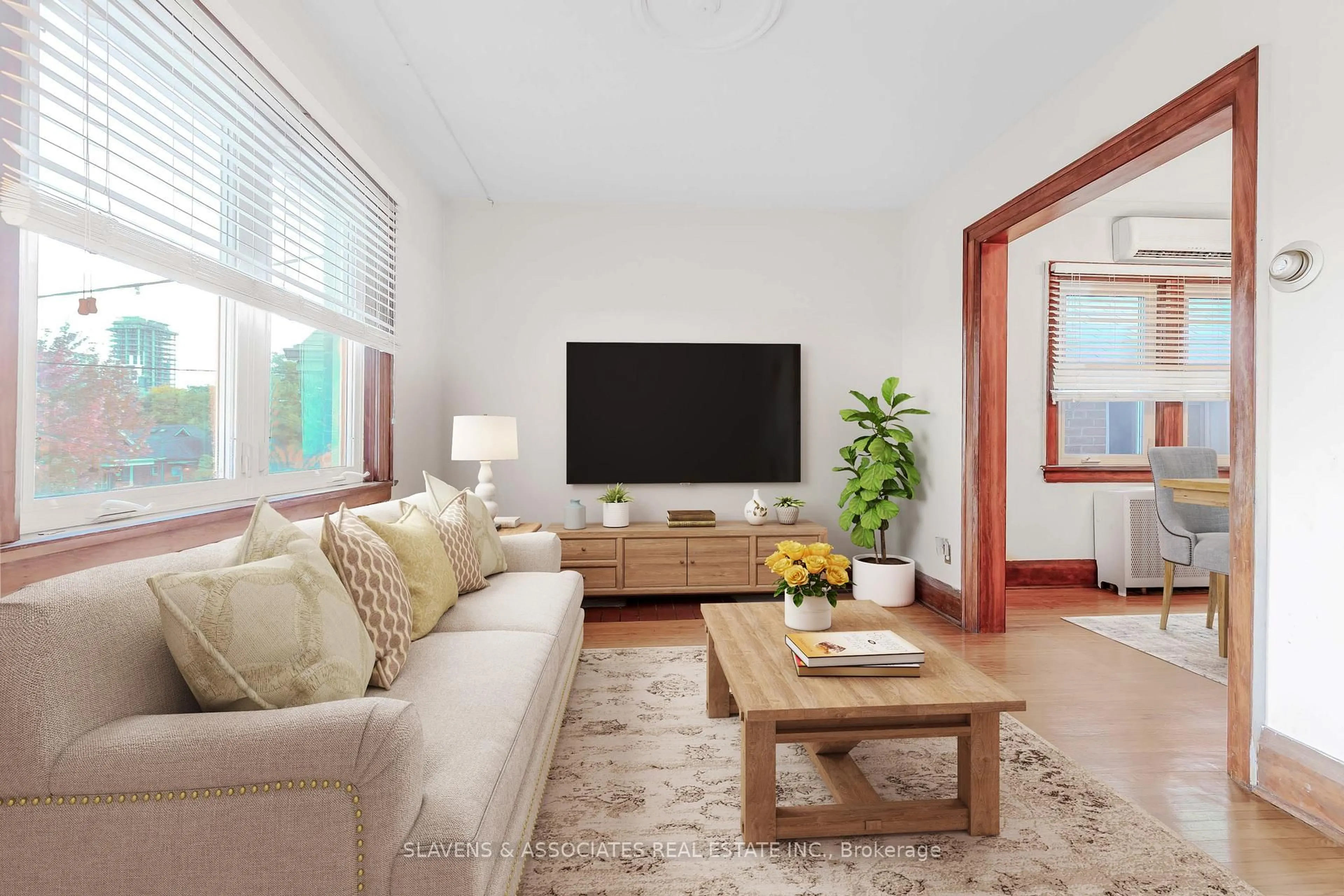 Living room with furniture, wood/laminate floor for 67 Belgravia Ave, Toronto Ontario M6E 2M4